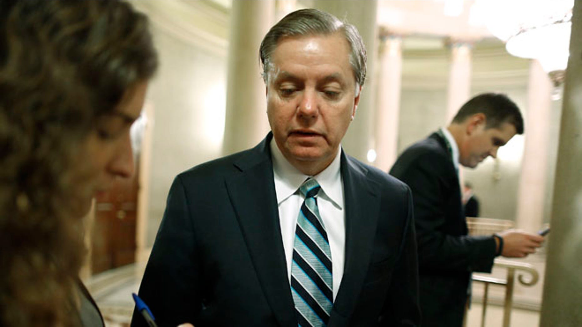 Oct. 16, 2013: Sen. Lindsey Graham, R-S.C., speaks to a reporter on Capitol Hill.