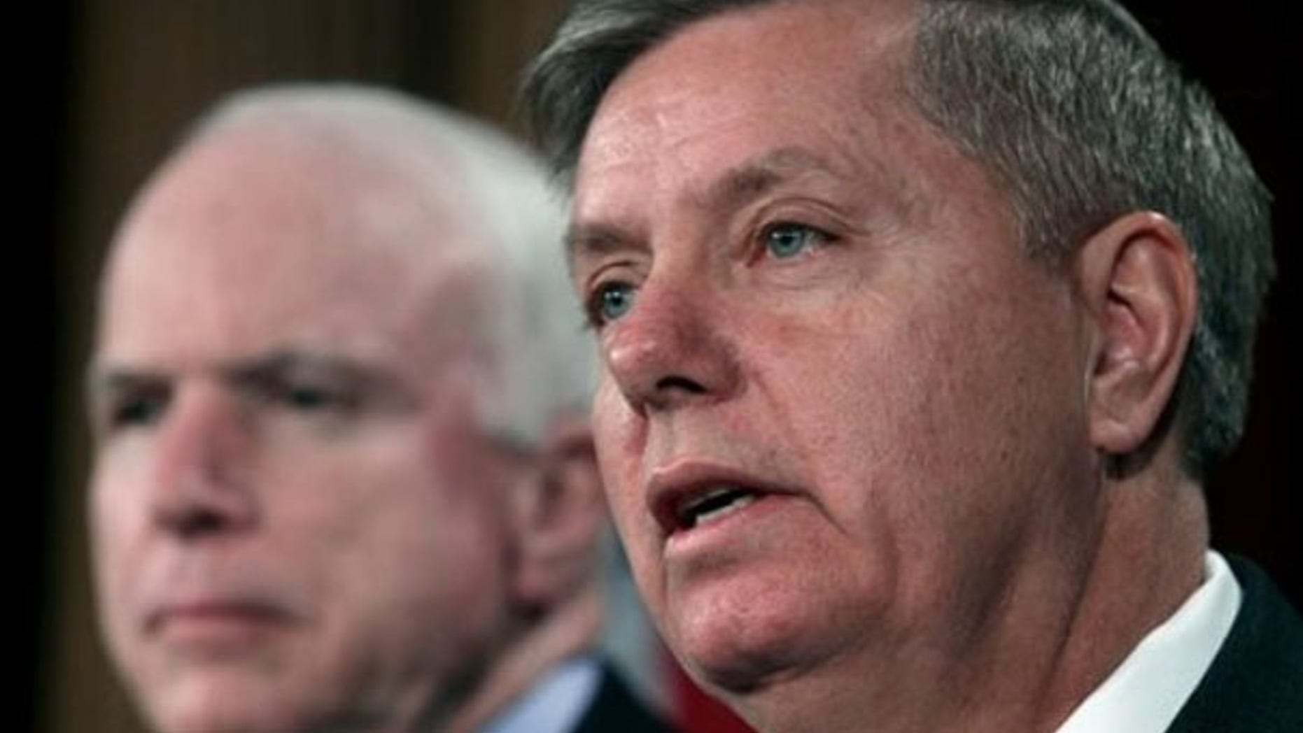 FILE: Feb. 2, 2012: Sen. Lindsey Graham, right, and Sen. John McCain are shown speaking to reporters on Capitol Hill in Washington.