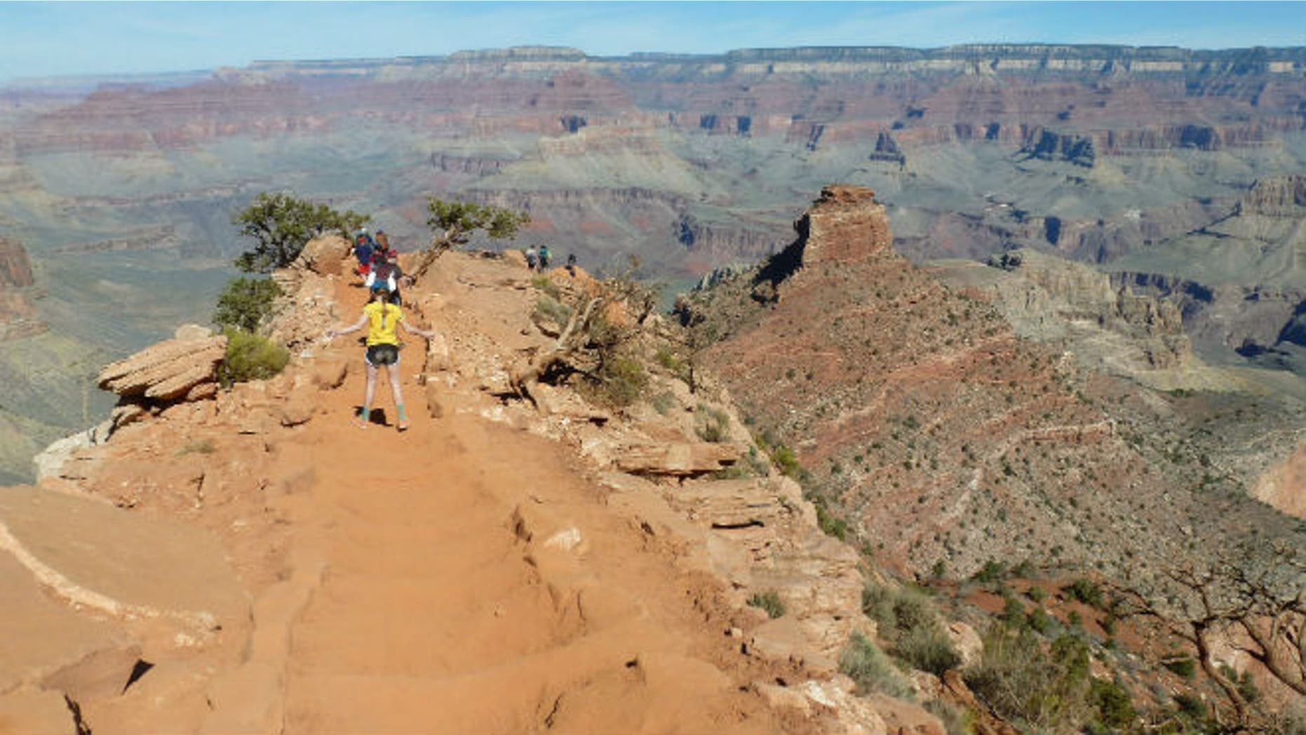 Hikers make their way along a ridgeline on the Grand Canyon National Park’s South Kaibab trail on March 16, 2015. (AP Photo/Anna Johnson)