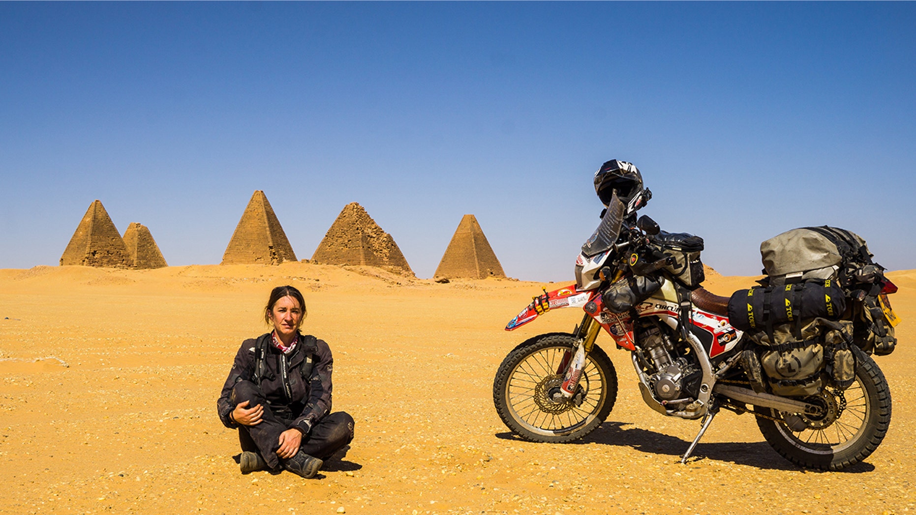 A grandmother from Wales just returned from a four-year journey around the world, all by motorbike.