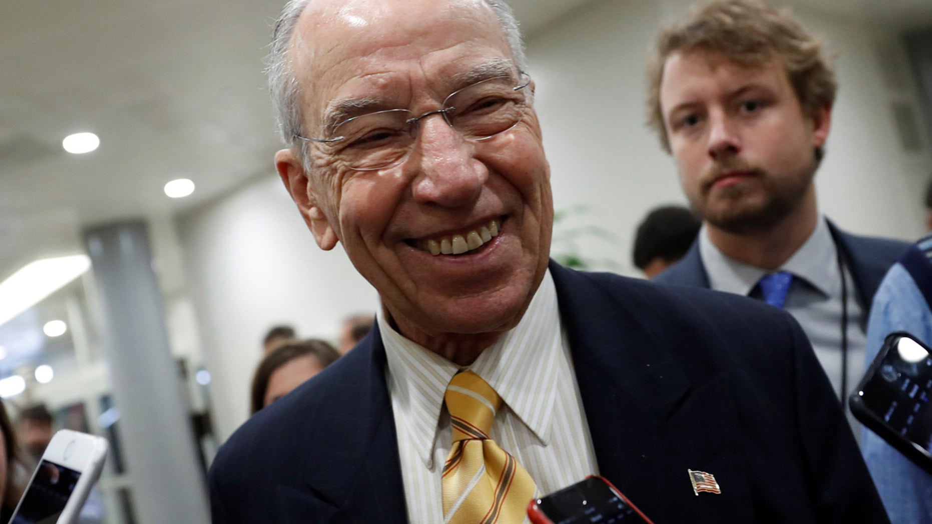 Sen. Chuck Grassley (R-IA) speaks with reporters ahead of the party luncheons on Capitol Hill in Washington, U.S. November 14, 2017. REUTERS/Aaron P. Bernstein - RC173F1C2CC0