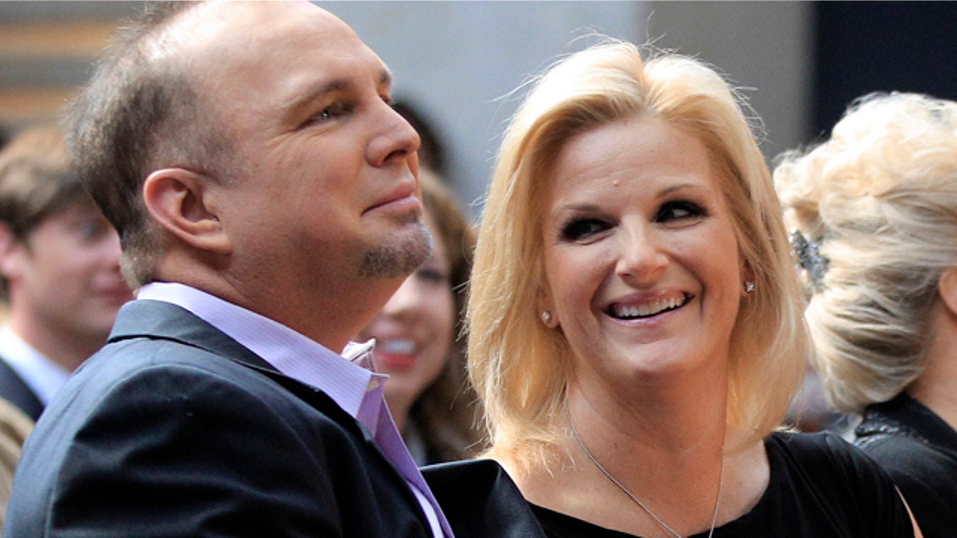 March 6: Garth Brooks and his wife Trisha Yearwood listen during the announcement that Brooks will be inducted into the Country Music Hall of Fame.