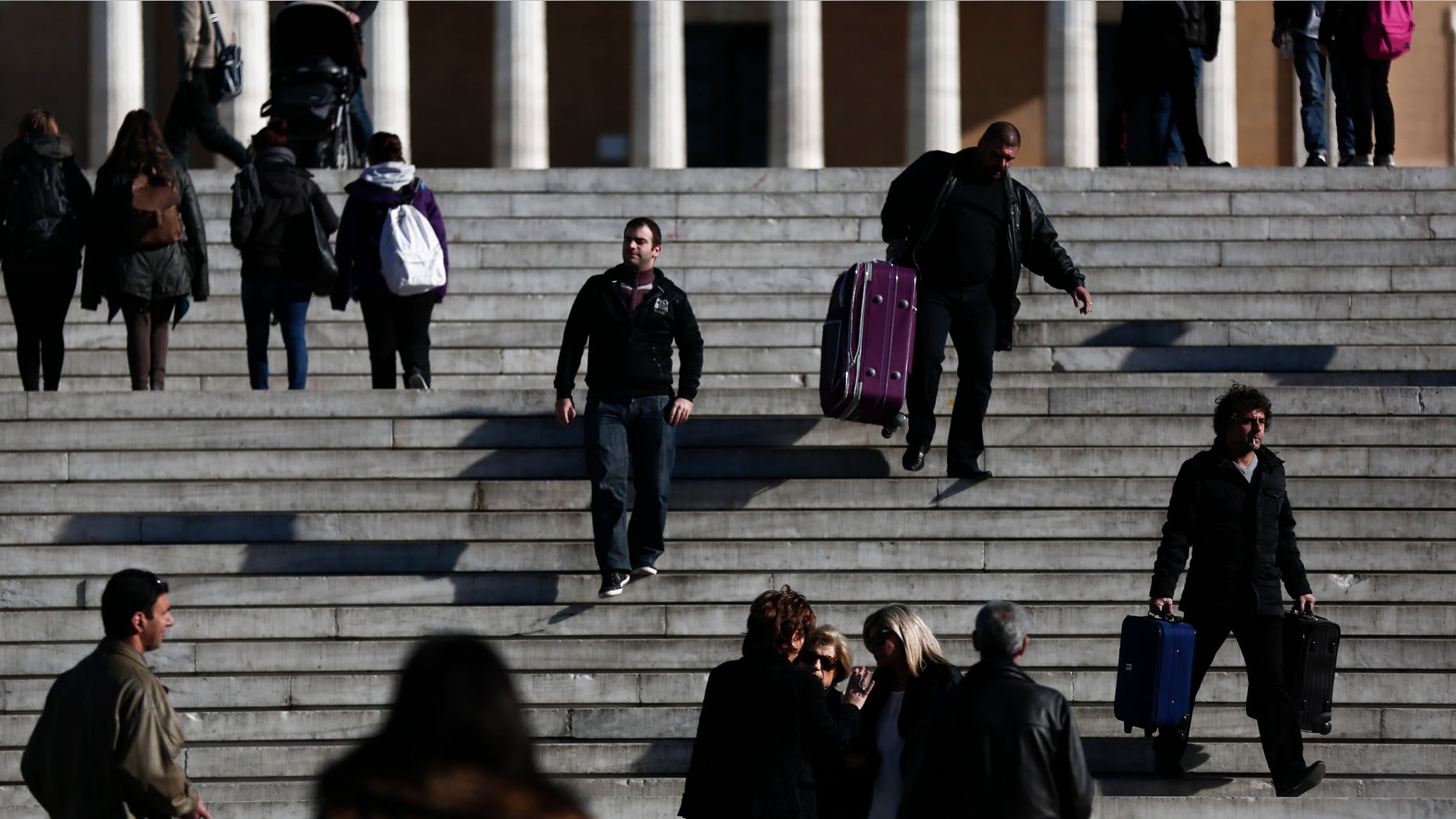 Jan. 9 ,2015: Pedestrians walk in front of the Greek parliament, in central Athens.