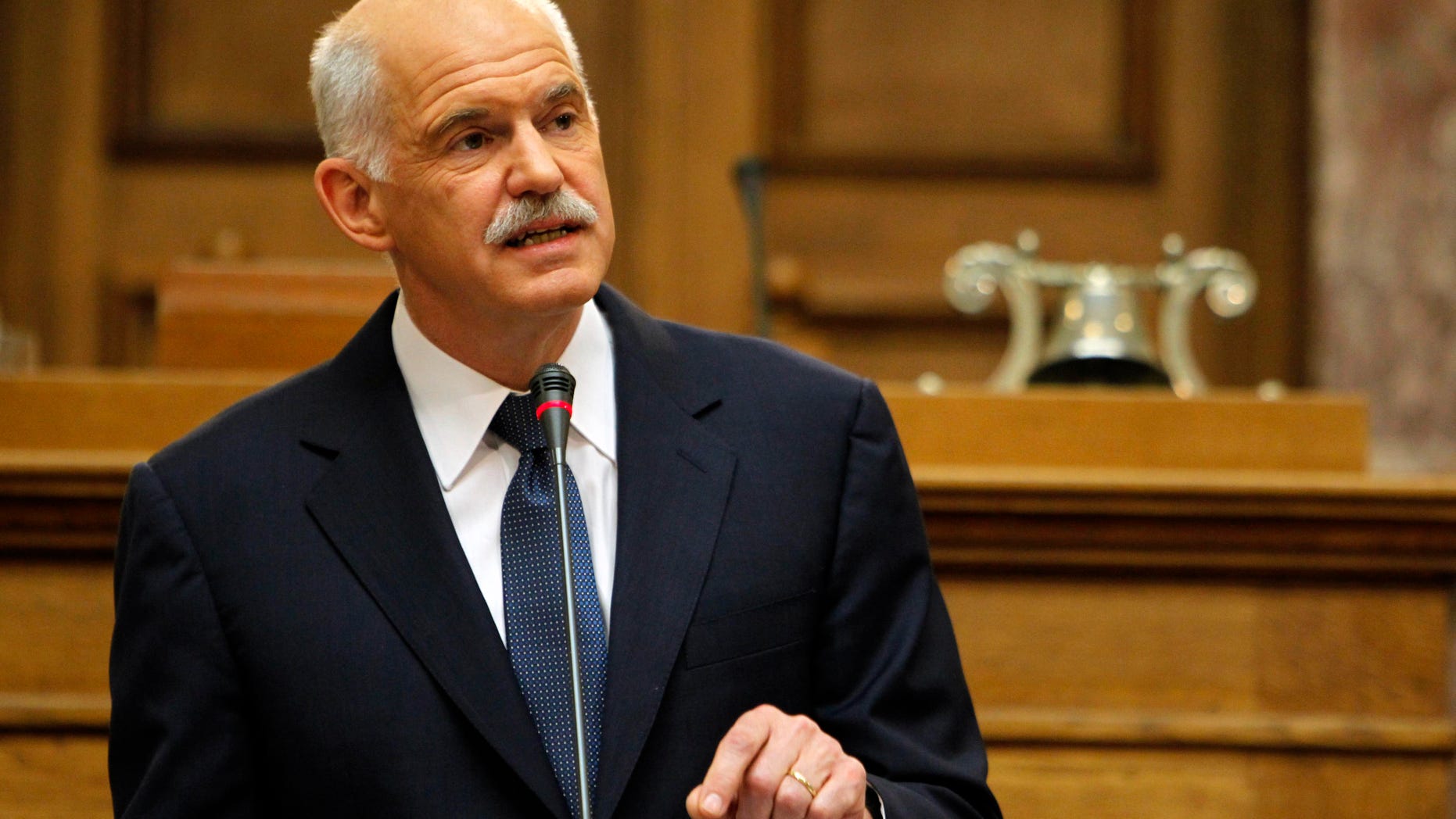 Oct. 31, 2011: Greek Prime Minister George Papandreou addresses Socialist members of parliament in Athens. Papandreou says his country will hold a referendum on a new European debt deal reached last week. Papandreou gave no date on other details of a proposed referendum on the deal that aims to seek 50 percent losses for private holders of Greek bonds and provide the troubled eurozone member with euro 100 billion ($140 billion) in additional rescue loans.