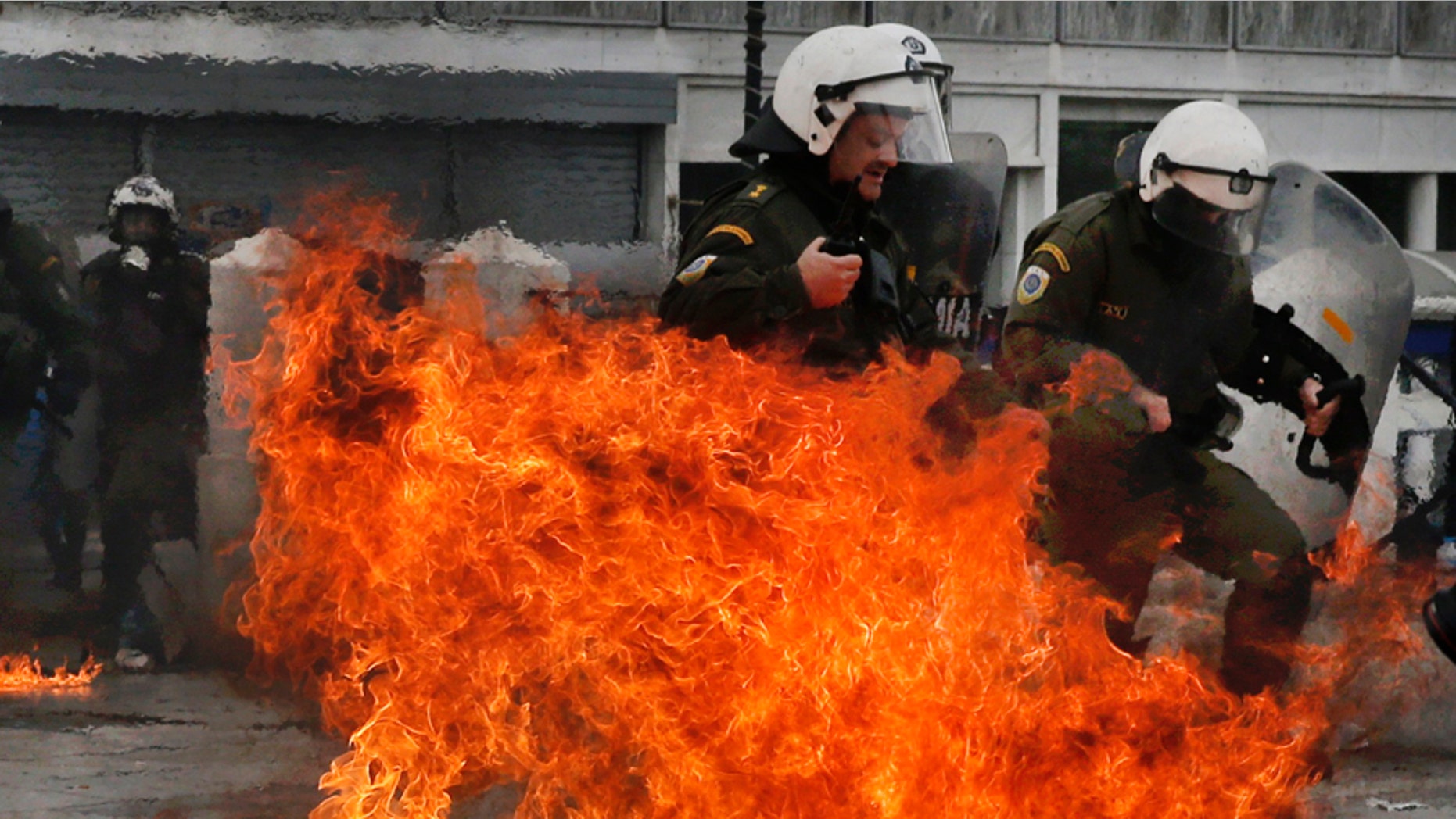 A radical, left-wing student group at the University of Texas posted a photo of a police officer on fire -- similar to the shot here from 2016 protests in Greece.