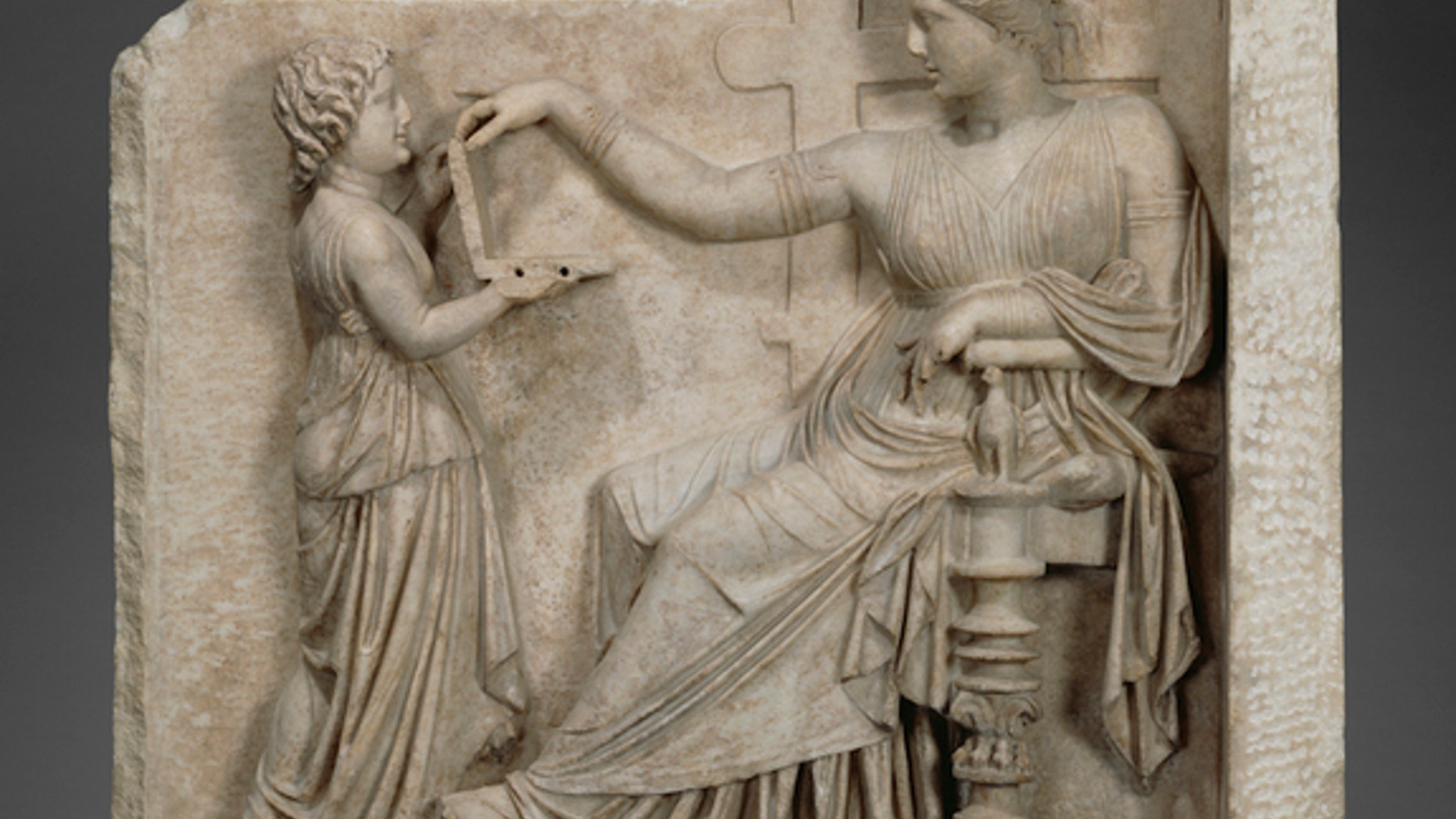 Is this ancient Greek woman checking Facebook on her so-called laptop?