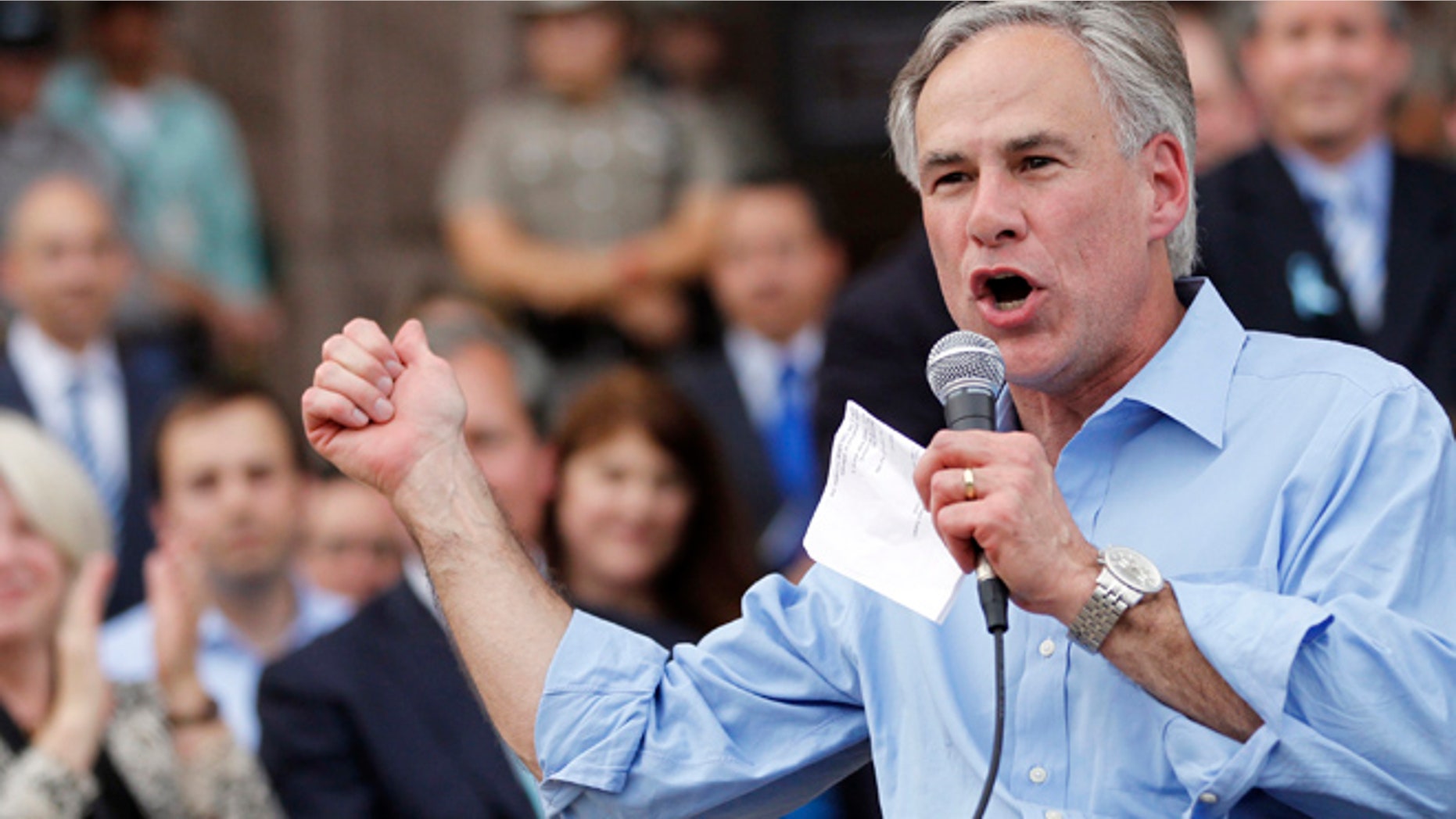 Texas Attorney General Greg Abbott speaks during an anti-abortion rally at the State Capitol in Austin, Texas, July 8, 2013. The political battle in Texas over proposed restrictions on abortion resumes on Monday with a rally by abortion opponents and a public hearing in the state Senate, where Democrat Wendy Davis staged a filibuster last month to stall the Republican-backed measure. REUTERS/Mike Stone (UNITED STATES) - RTX11HAF