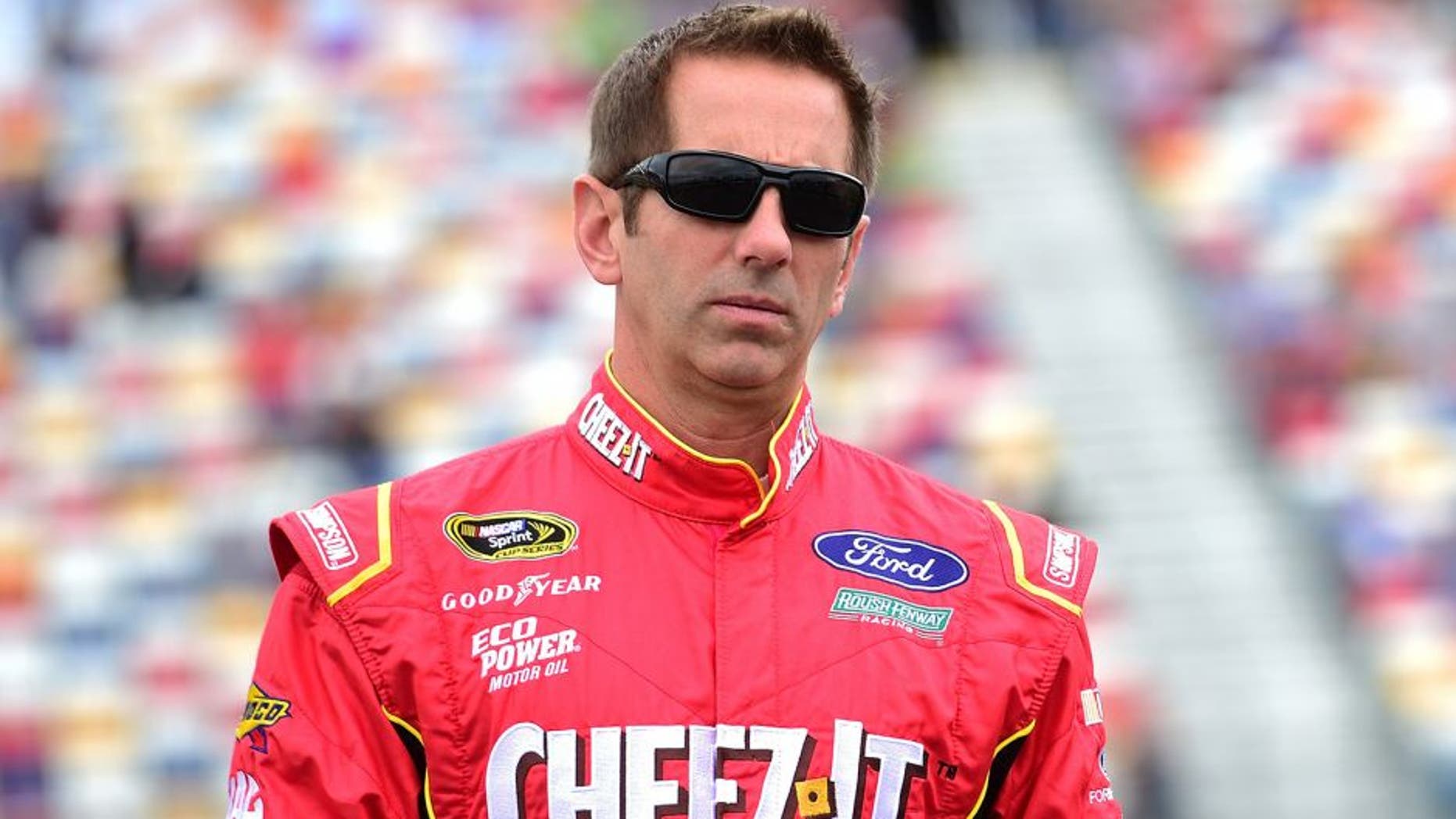 CHARLOTTE, NC - MAY 21: Greg Biffle, driver of the #16 Cheez-It Ford, walks on the grid prior to the NASCAR Sprint Cup Series Sprint Showdown at Charlotte Motor Speedway on May 21, 2016 in Charlotte, North Carolina. (Photo by Jared C. Tilton/Getty Images)