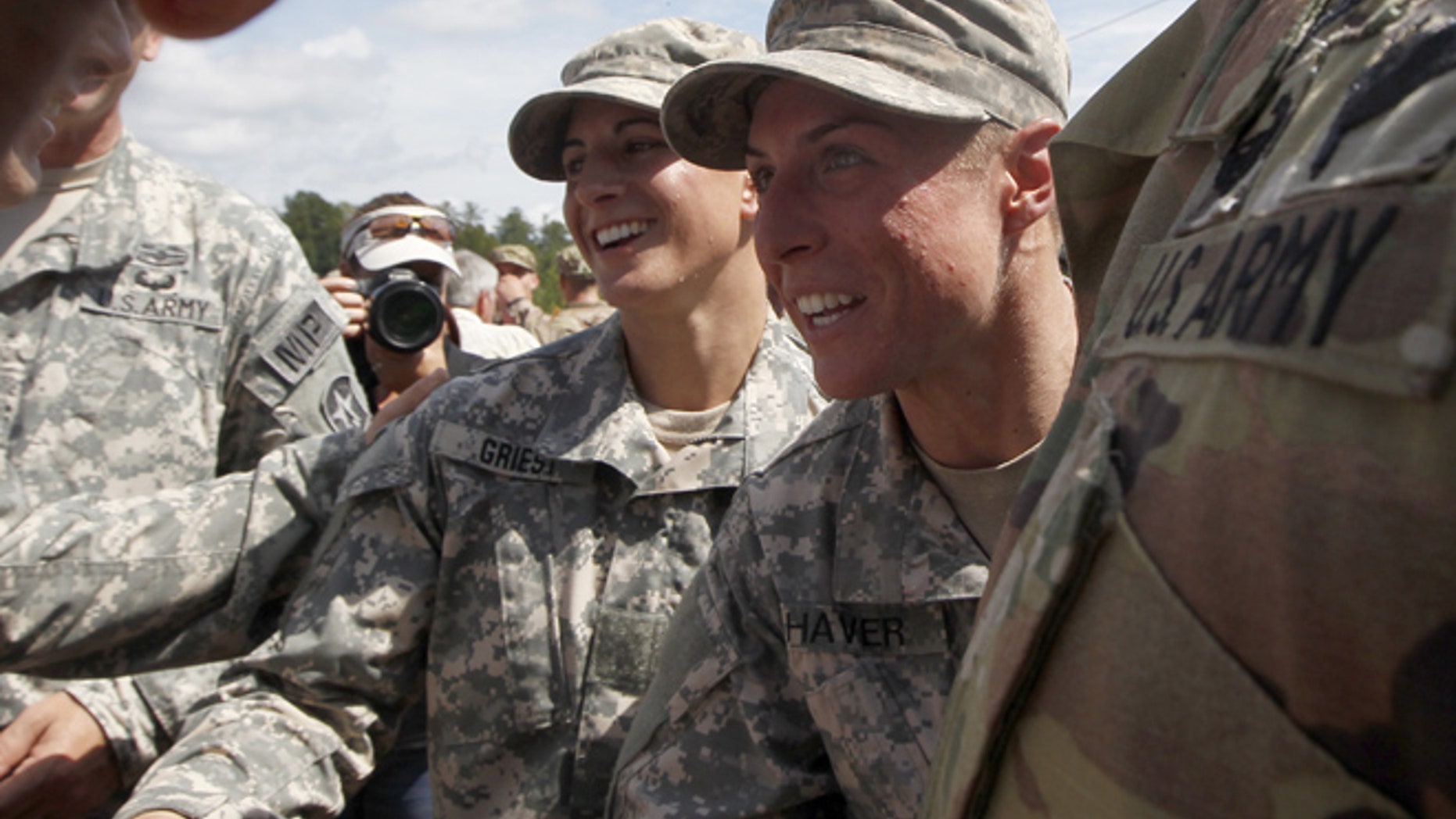 FILE 2015: From the left, Capt. Kristen Griest and 1st Lt. Shaye Haver are congratulated at Ranger school graduation at Fort Benning.