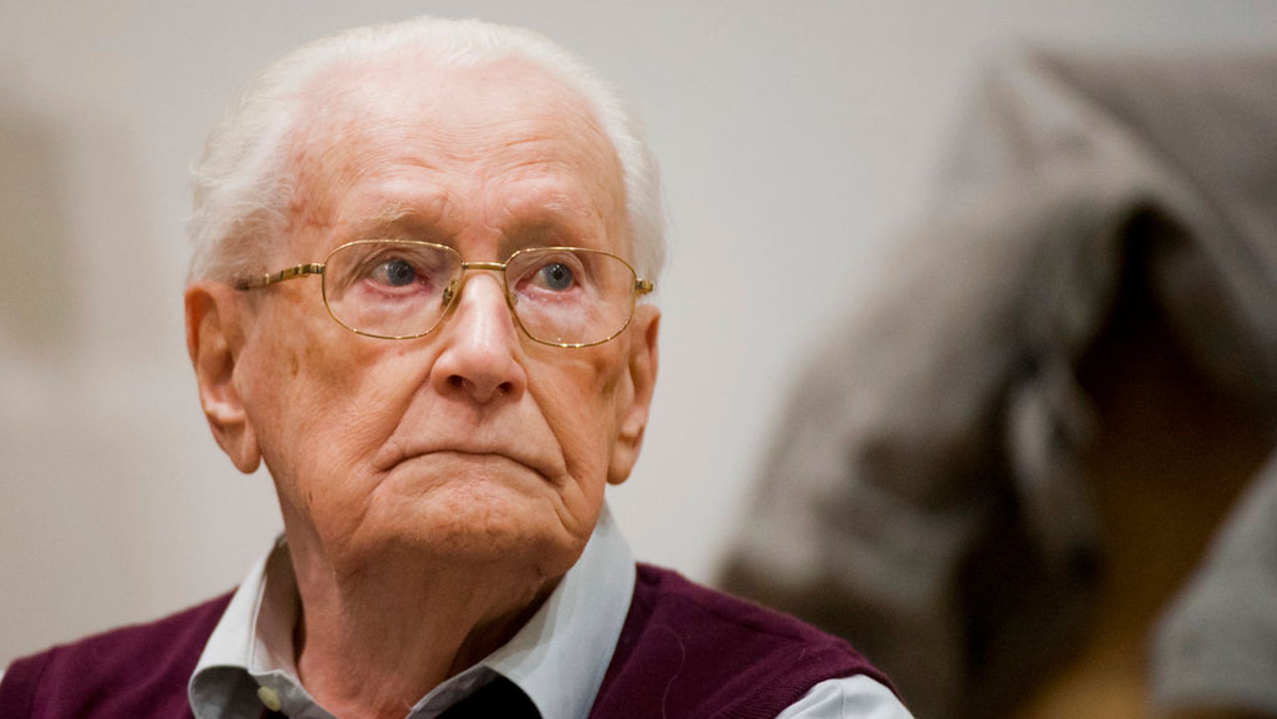 Former SS guard Oskar Groening waits for the start his trial in a courtroom in Lueneburg, northern Germany.