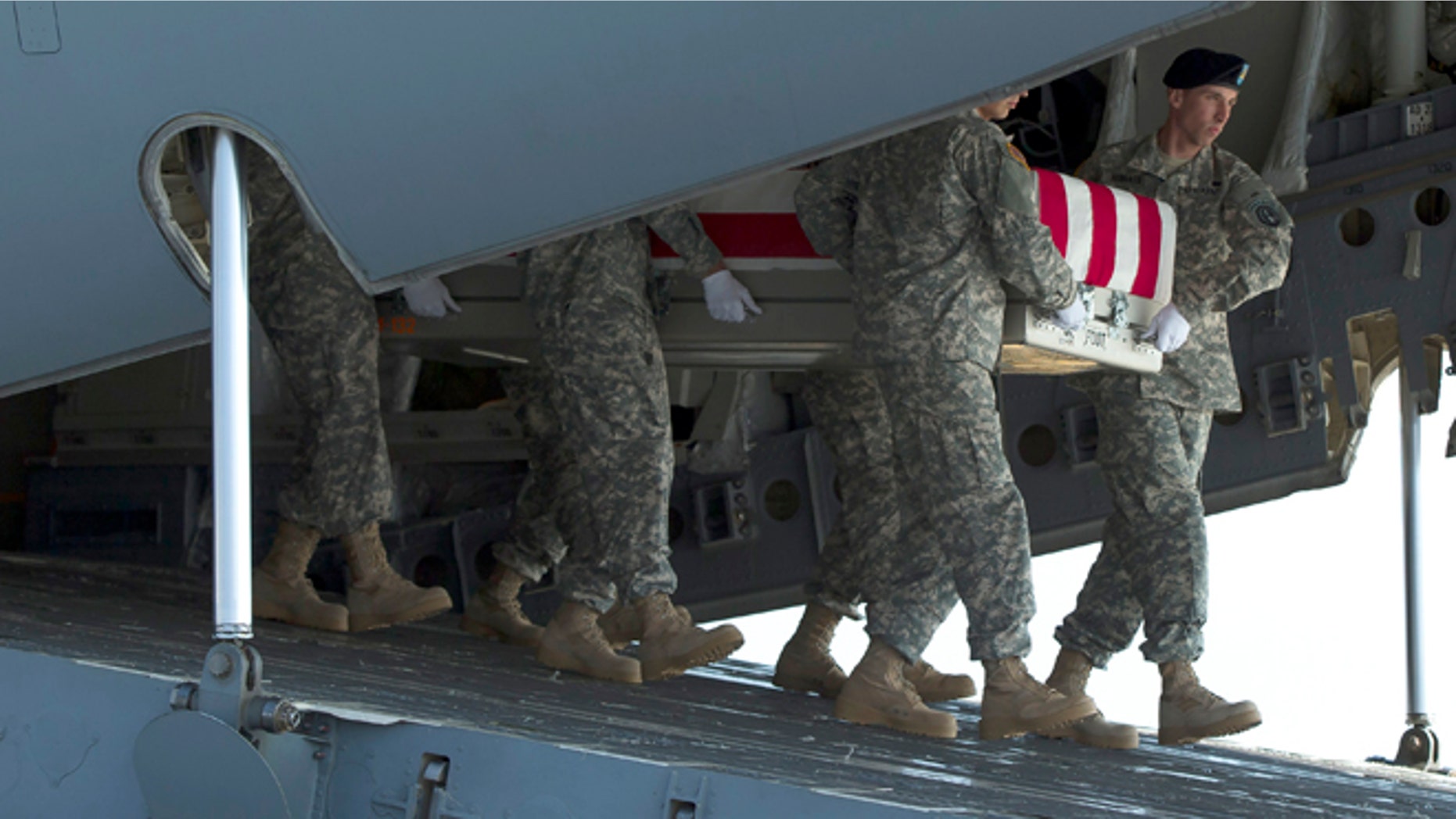 An Army carry team transfers the remains of Army Maj. Gen. Harold Greene, Thursday, Aug. 7, 2014, at Dover Air Force Base, Del.The C-17 cargo plane carrying the body of Harold Greene landed Thursday morning at Dover, home to the nation's largest military mortuary. Greene is the highest-ranked U.S. officer to be killed in combat since 1970 during the Vietnam War. Greene, a 34-year U.S. Army veteran, also is the highest-ranked American officer killed in combat in the wars in Afghanistan and Iraq. (AP Photo/Evan Vucci)