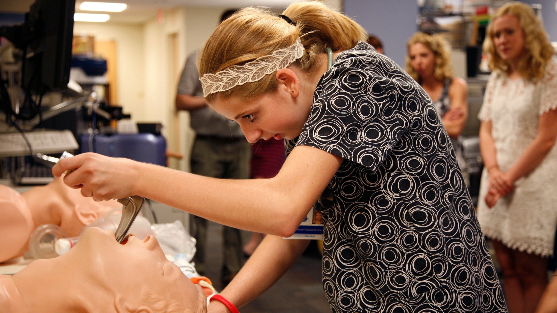 Gabrielle Samsock, 14, performing a procedure on a simulation mannequin