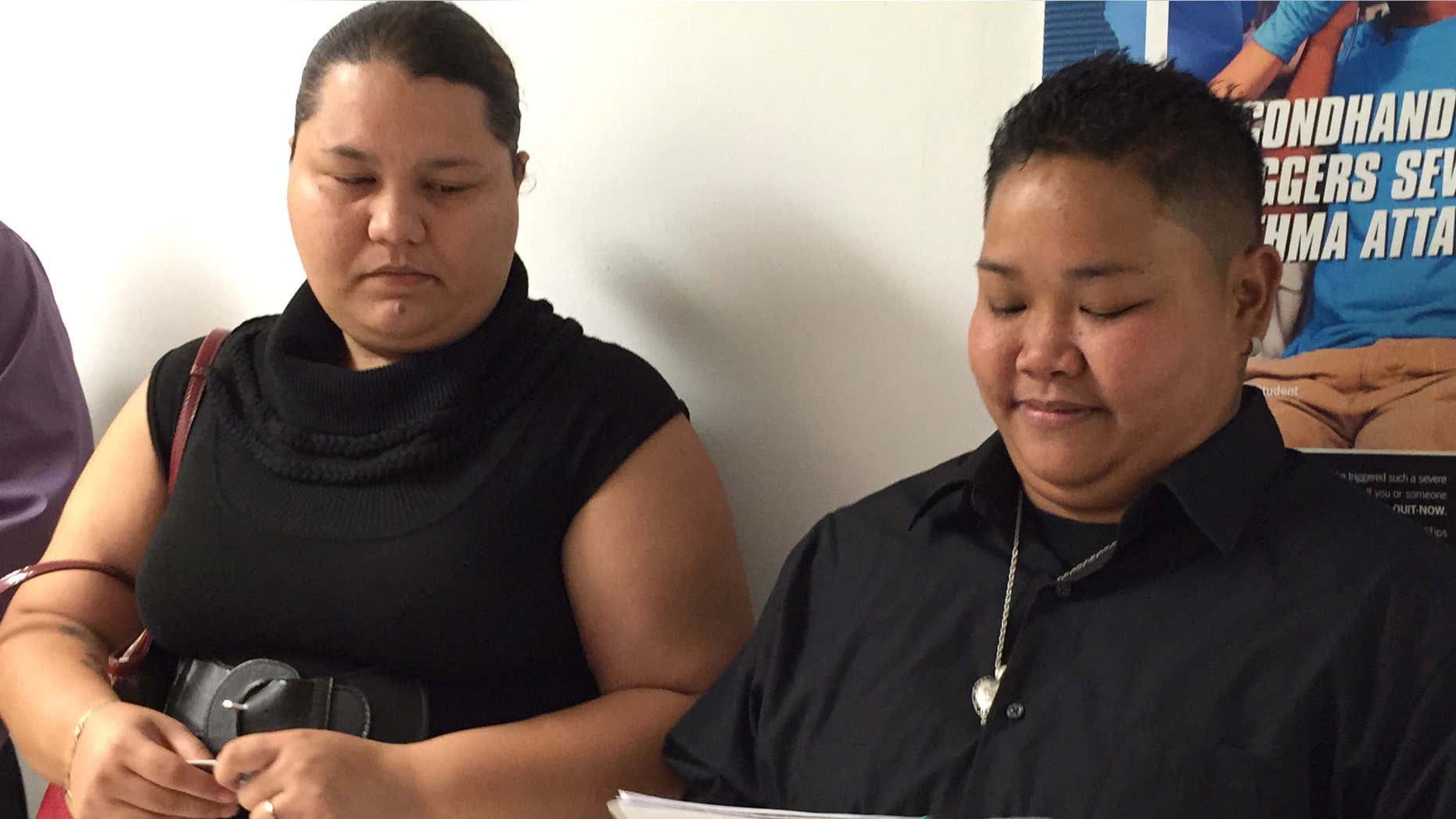 April 8, 2015: Loretta M. Pangelinan, 28, holds the application for a marriage license that she and her fiancee, Kathleen M. Aguero, 28, will turn in at the Office of Vital Statistics in the Guam Department of Public Health and Social Services.