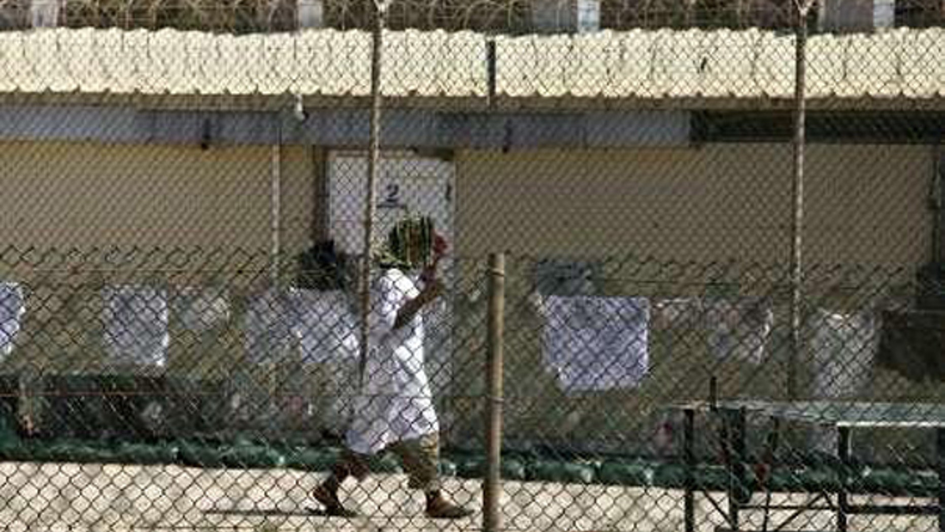 In this May file photo, a detainee walks inside the open-air yard at Camp 4 detention facility at Guantanamo Bay U.S. Naval Base, Cuba. (Reuters Photo)