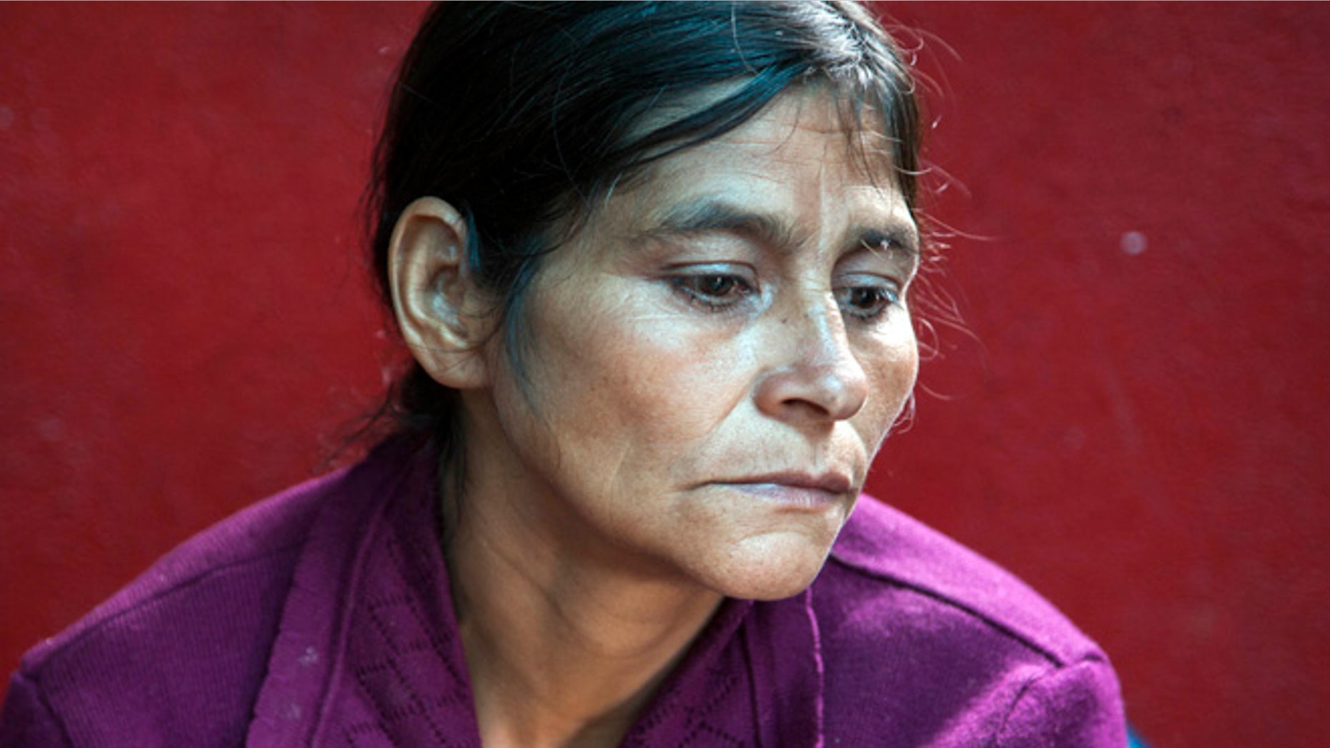 July 1, 2014: Cipriana Juarez Diaz, mother of Gilberto Francisco Ramos Juarez, a Guatemalan boy whose decomposed body was found in the Rio Grande Valley of South Texas, listens to her husband talk during an interview at their home in San Jose Las Flores, in the northern Cuchumatanes mountains of Guatemala.