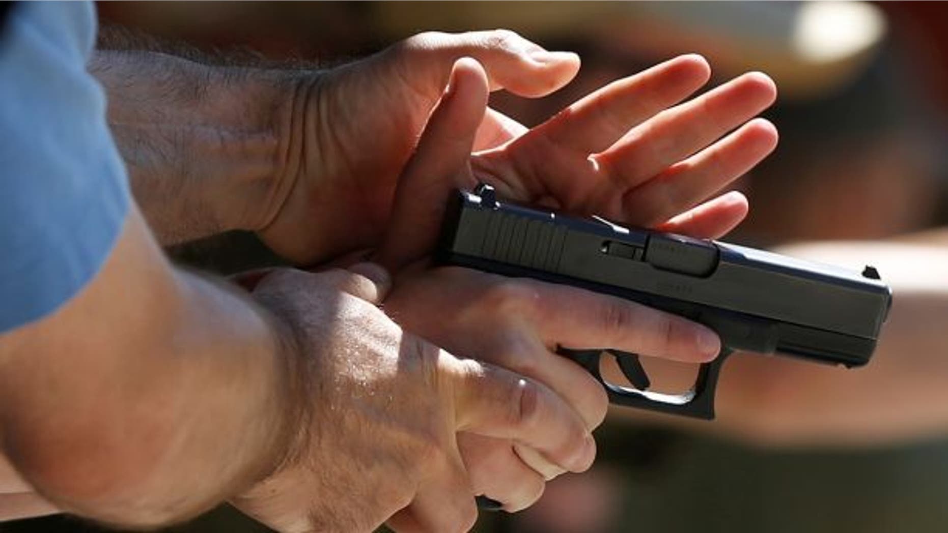 A New Jersey high school came under fire Friday after it allegedly suspended two students over a gun photo taken during a family visit to a shooting range.