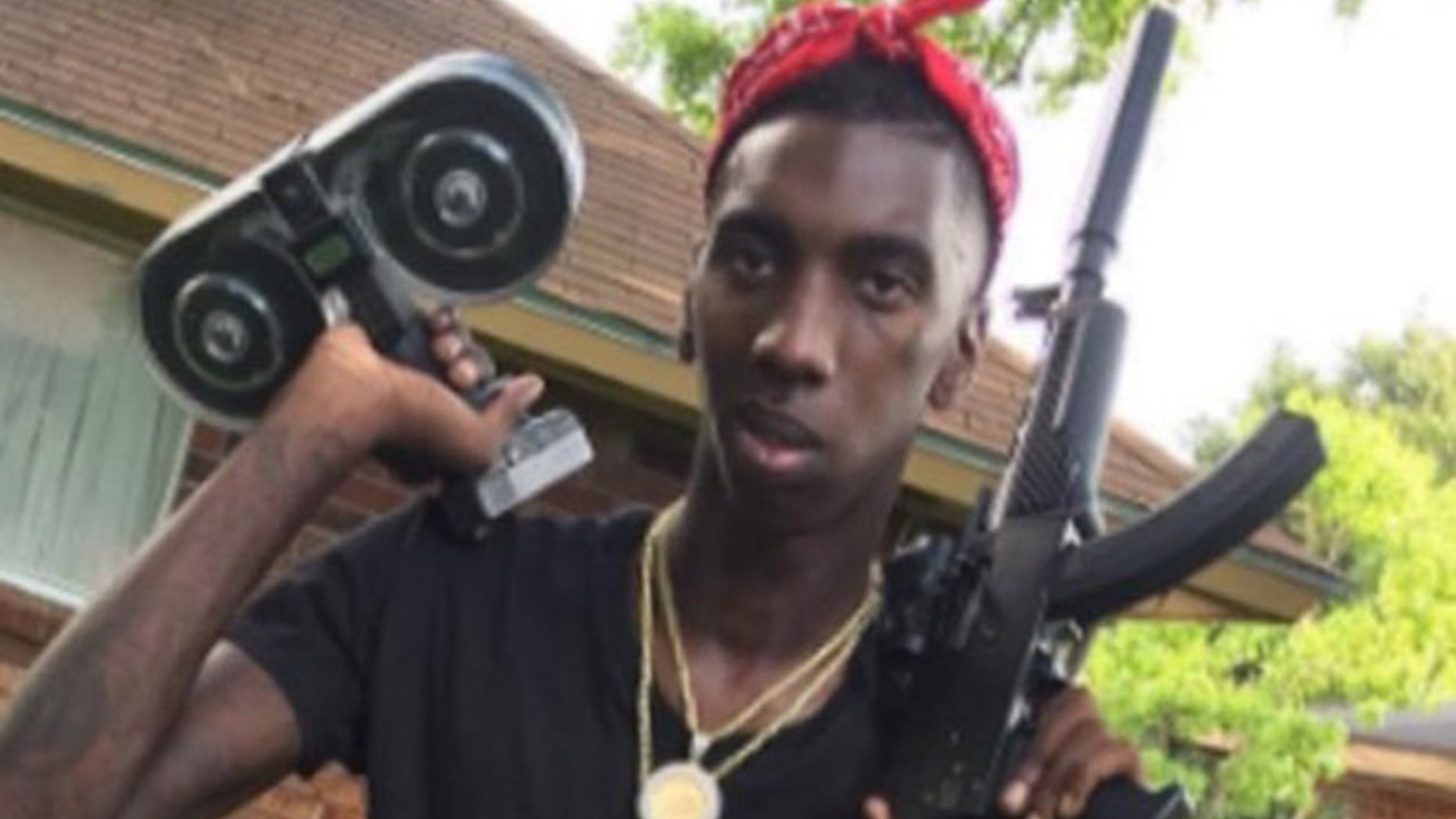 Demarcus Davis was seen brandishing the stolen weaponry on an online video, according to police. (Screengrab)