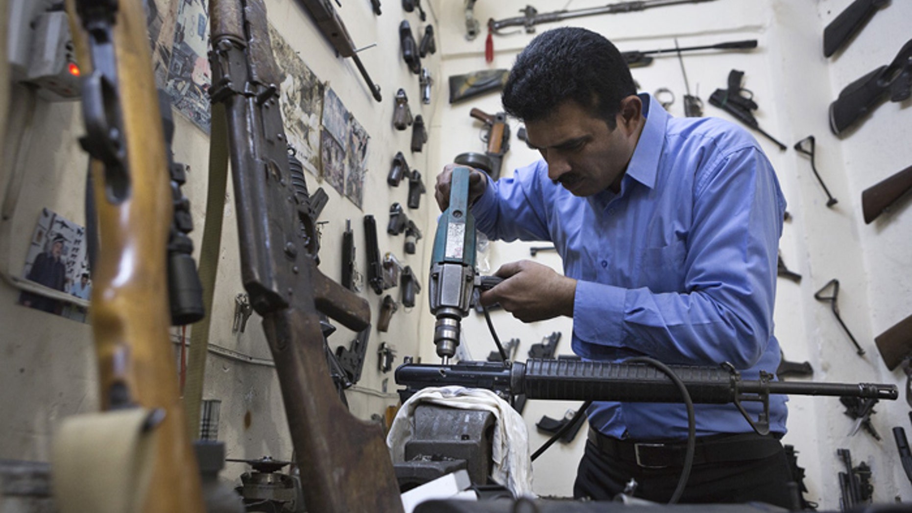 Kurdish gunsmith Bakhtian Aziz learned his trade from his father. (Photo by Matt Cetti-Roberts)