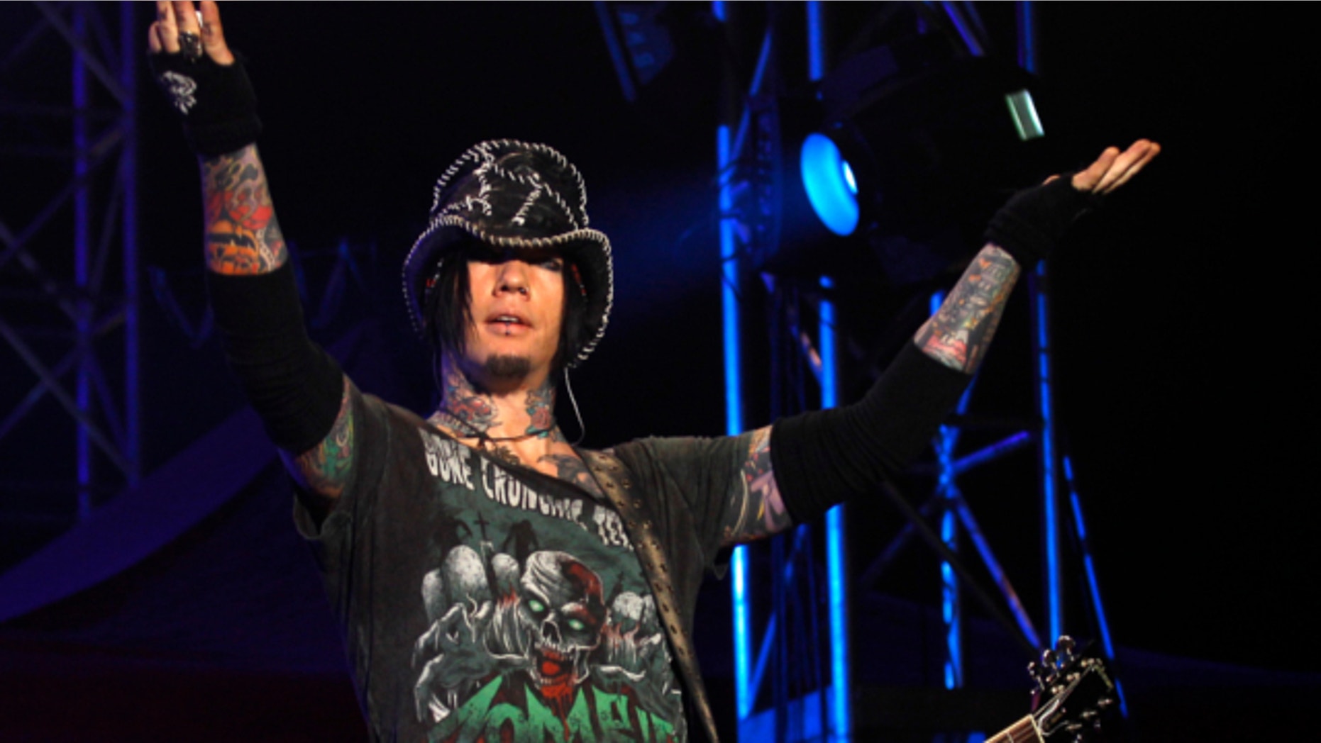 Dec. 7,2012: Guns N' Roses guitarist DJ Ashba reacts to the crowd as he performs during a concert in Bangalore, India. Las Vegas police are investigating whether employees went too far after reportedly helping Ashba with an elaborate proposal.