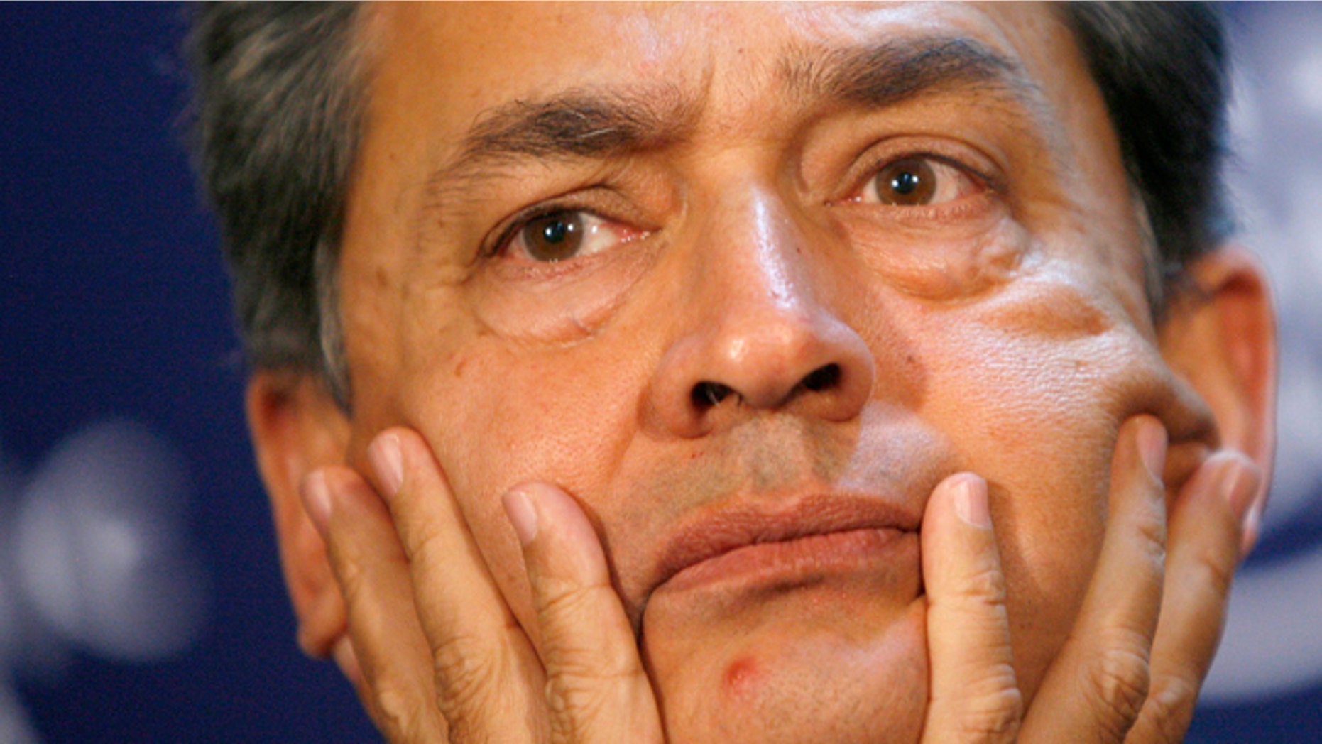 Jan. 3, 2009: FILE - In this file photo, Rajat Kumar Gupta, former Chairman of Global Fund to Fight AIDS, Tuberculosis and Malaria, listens to a statement, during a session at the World Economic Forum in Davos, Switzerland. Gupta, former Goldman Sachs board member, surrendered to federal authorities Wednesday, Oct. 26, 2011 in New York to face criminal charges stemming from a massive hedge fund insider trading case.