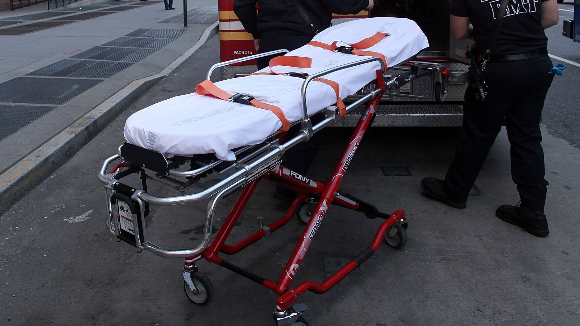 NEW YORK - APRIL 07: A gurney is placed back inside of an ambulance in front of St. Vincent's Hospital on April 7, 2010 in New York City. On Tuesday the board of St. Vincent Catholic Medical Centers voted to close the hospital following its unsuccessful search to find a way out of its estimated $700 million of debt. The Westside hospital, which has served Manhattan for 160 years, may retain some of its services like an urgent care facility. (Photo by Spencer Platt/Getty Images)