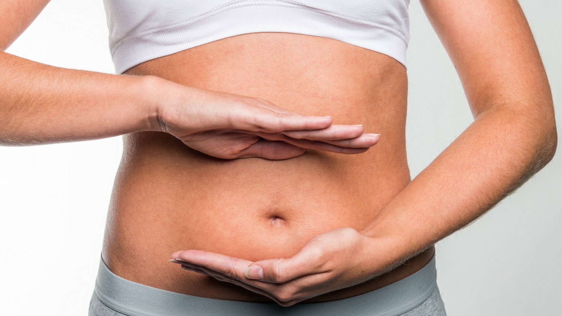 circle of hands on stomach