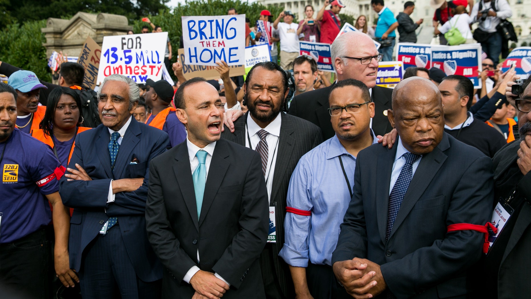 (L-R) Rep. Charles Rangel (D-NY), Rep. Luis Gutierrez (D-IL), Rep. Al Green (D-TX), Rep. Keith Ellison (D-MN) and Rep. John Lewis (D-GA) stand with immigration reform supporters in front of the U.S. Capitol.