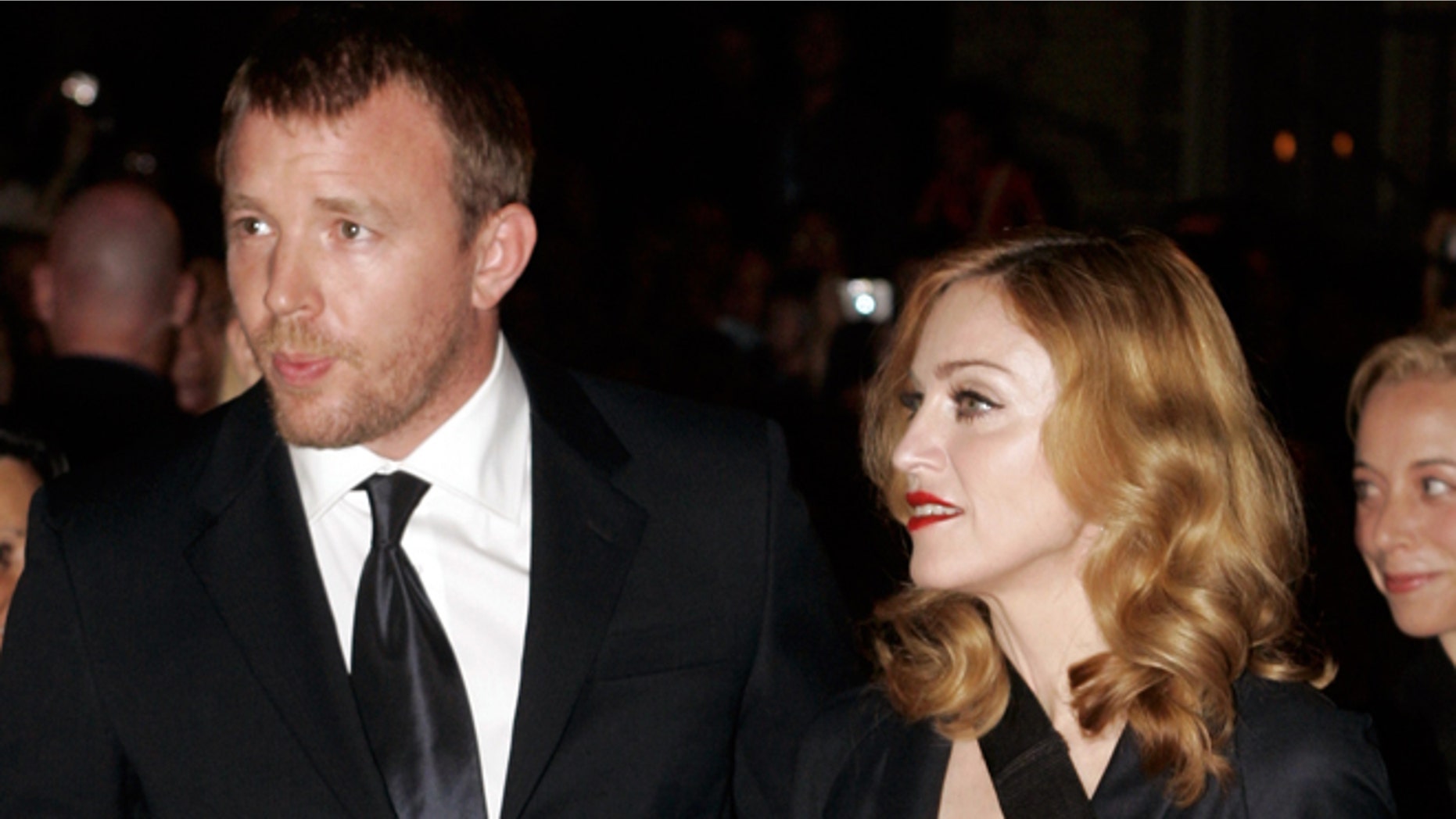 September 11, 2005. Madonna (R) arrives with her husband, director Guy Ritchie, for the world premiere of Ritchie's film "Revolver" in Toronto.