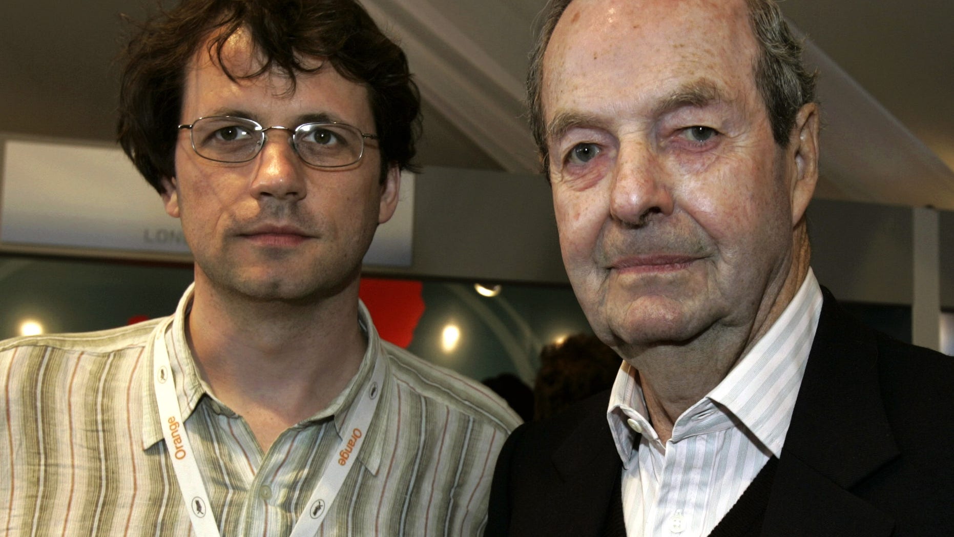 FILE In this file photo, dated Saturday May 14, 2005, Frederick Baker, the Anglo-Austrian director of "Shadowing The Third Man", left, and Britain's Guy Hamilton, director of four James Bond films, pose prior to their joint press conference at the 58th international Cannes film festival in Cannes, southern France. A hospital on his home island of Mallorca said he died aged 93 on Wednesday April 20, 2016. (AP Photo/Michel Euler, FILE)