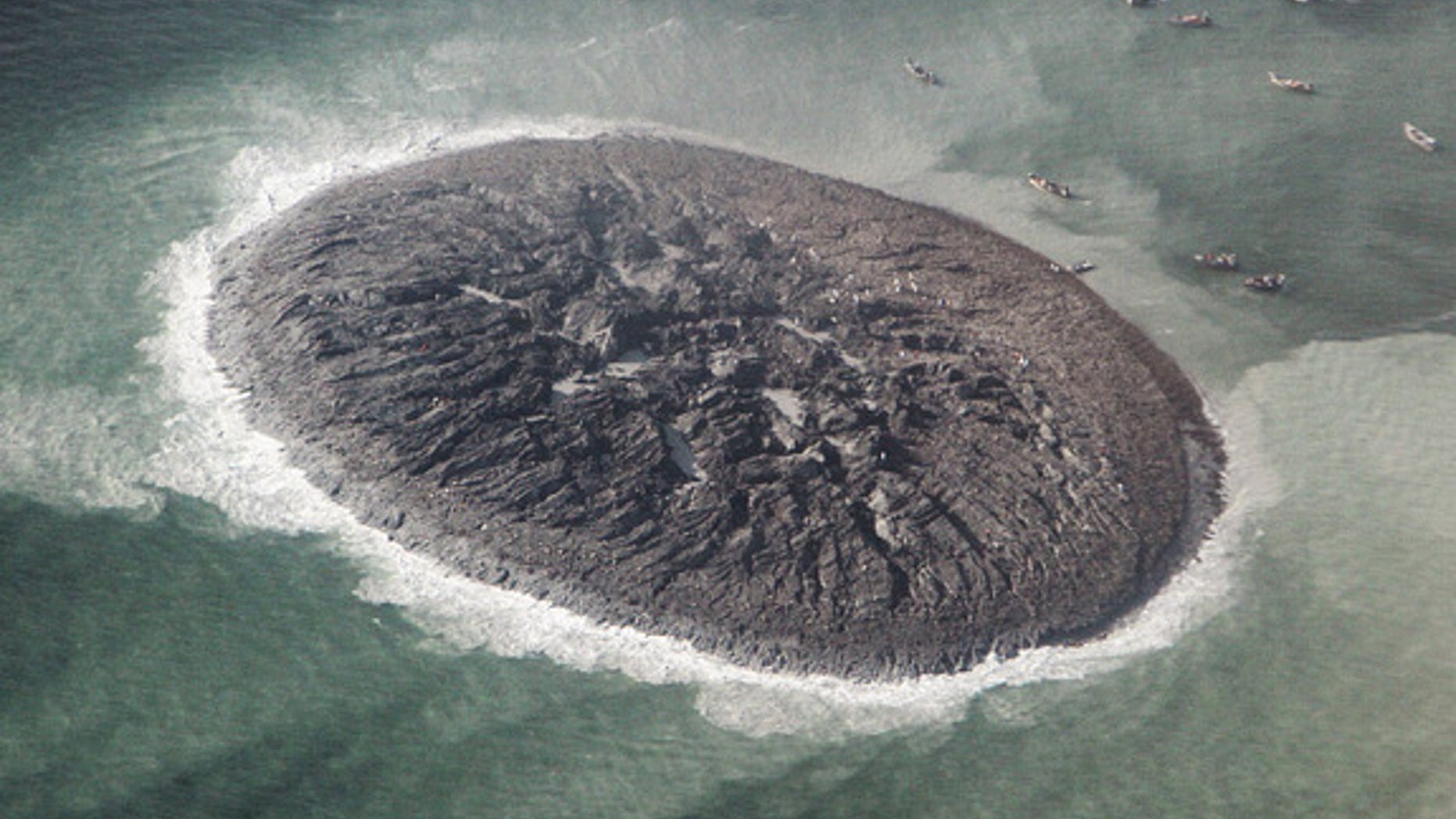 An aerial photo from Pakistan's National Institute of Oceanography suggests the new island is 60 to 70 feet (15 to 20 meters) tall.