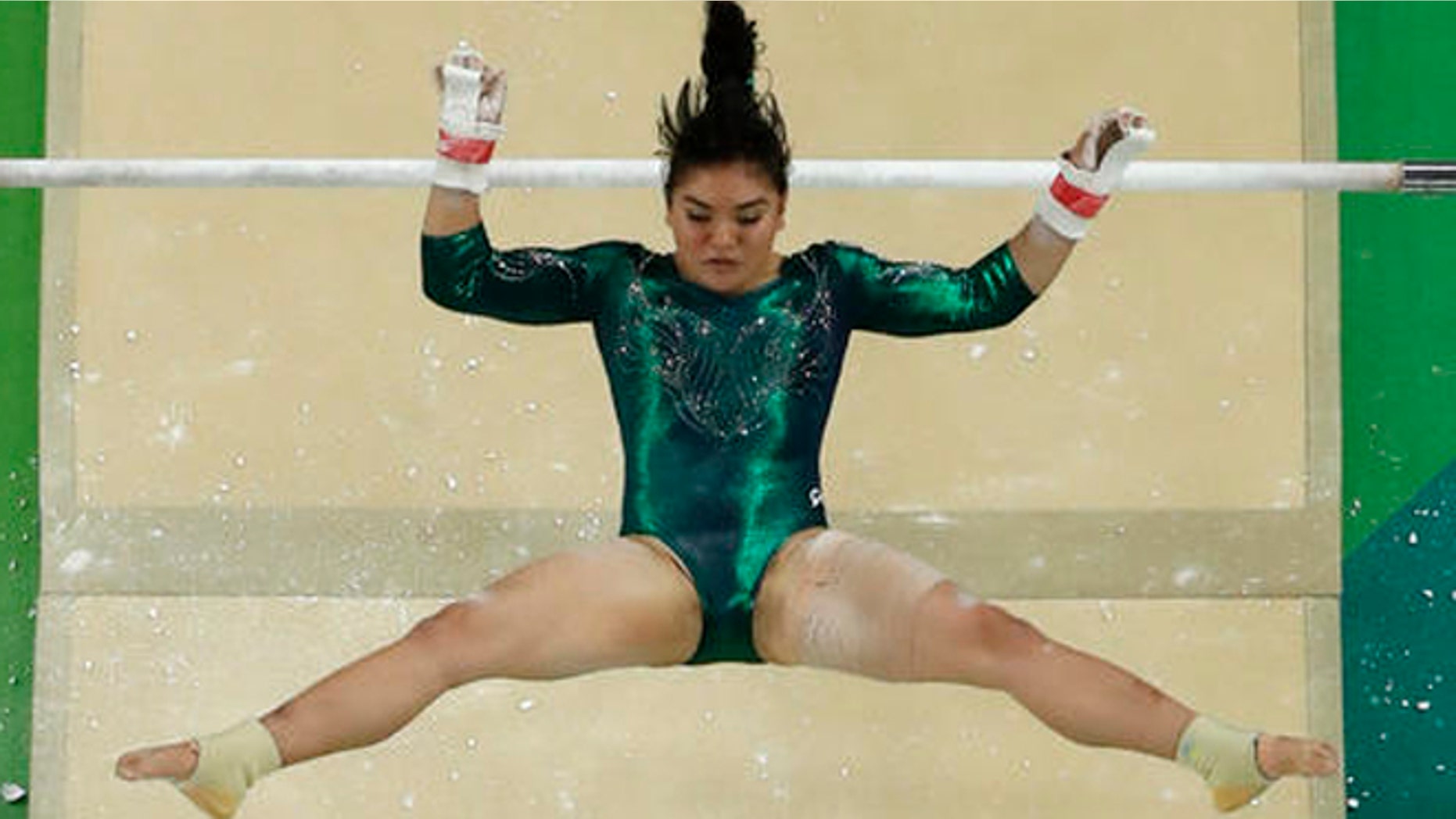 Mexico's Alexa Moreno performs on the uneven bars during the artistic gymnastics women's qualification at the 2016 Summer Olympics in Rio de Janeiro, Brazil, Sunday, Aug. 7, 2016. (AP Photo/Morry Gash)
