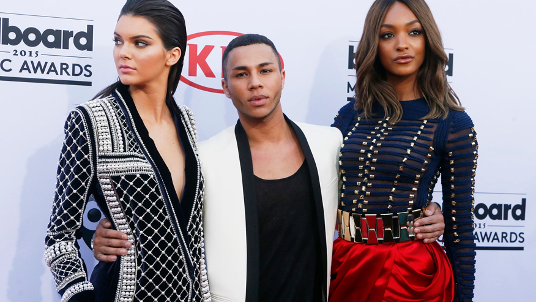 Model Kendall Jenner (L), designer Olivier Rousteing and model Jourdan Dunn arrive in H&M Balmain pieces at the 2015 Billboard Music Awards in Las Vegas, Nevada May 17, 2015.