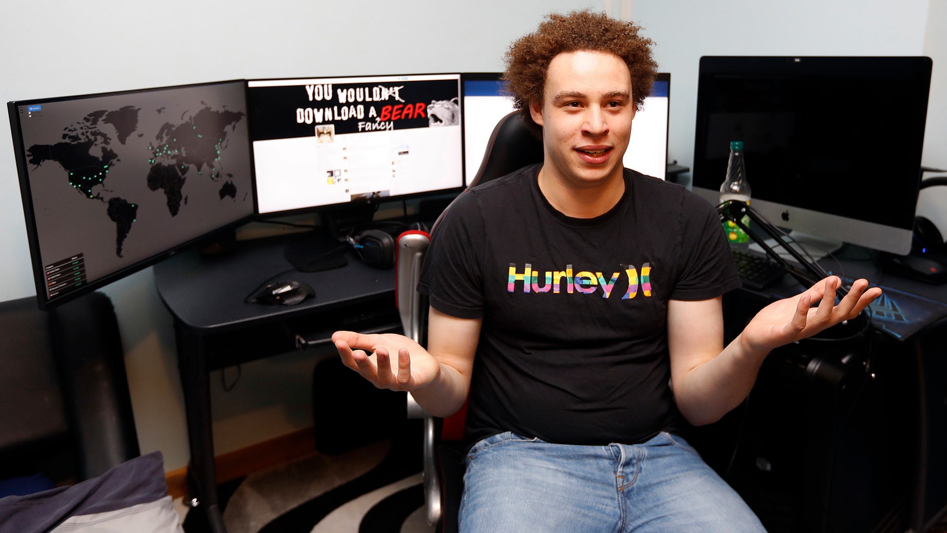 FILE - In this Monday, May 15, 2017, file photo, British IT expert Marcus Hutchins speaks during an interview in Ilfracombe, England. Hutchins, a young British researcher credited with derailing a global cyberattack in May, has been arrested for allegedly creating and distributing banking malware, U.S. authorities say. (AP Photo/Frank Augstein, File)