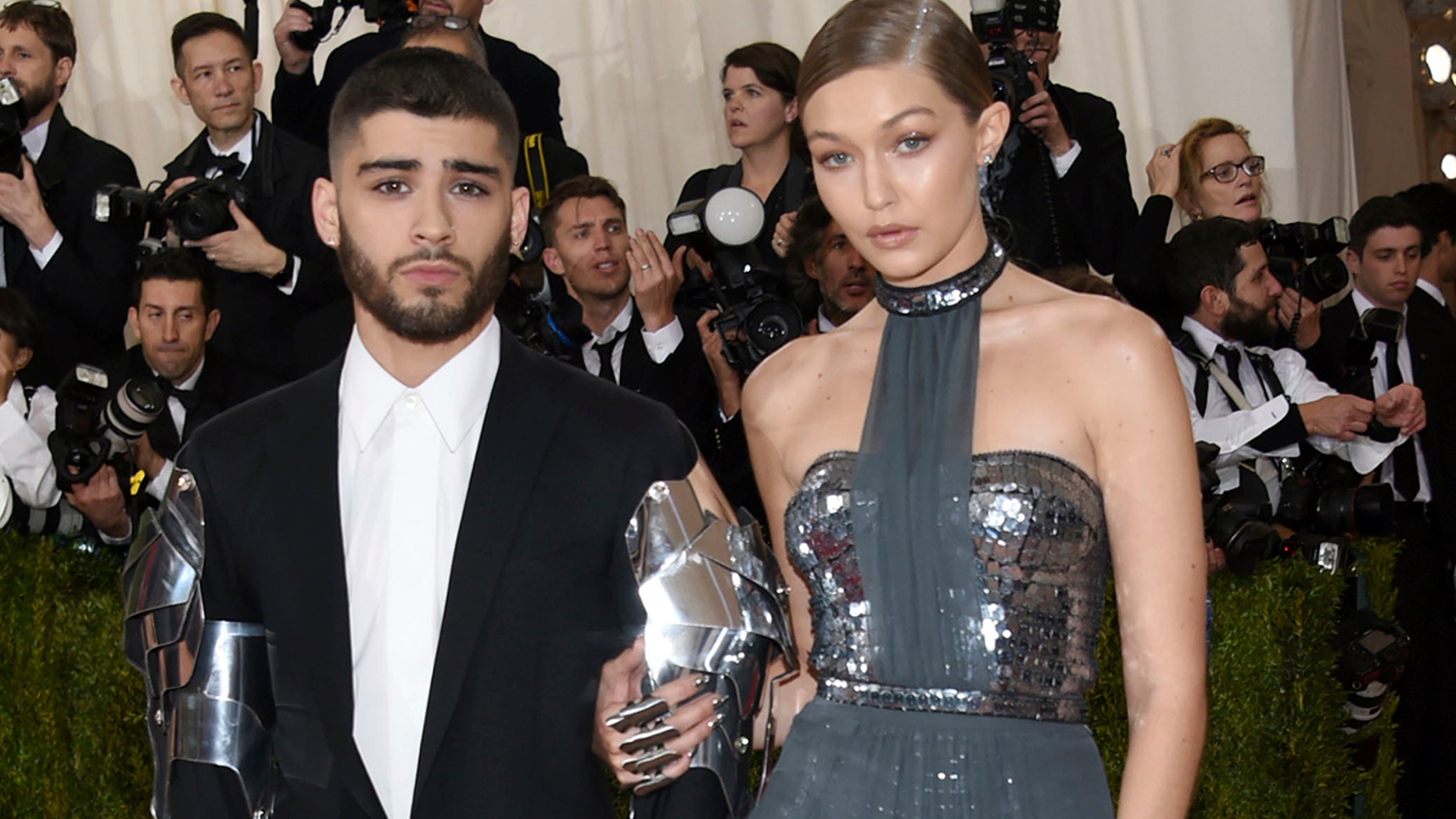 FILE - In this May 2, 2016 file photo, Zayn Malik, left, and Gigi Hadid arrive at The Metropolitan Museum of Art Costume Institute Benefit Gala in New York. Hadid and Malik are confirming on social media that their romance is over. The 22-year-old model and 25-year-old musician each posted on Twitter Tuesday about the end of their two-year relationship. (Photo by Evan Agostini/Invision/AP, File)