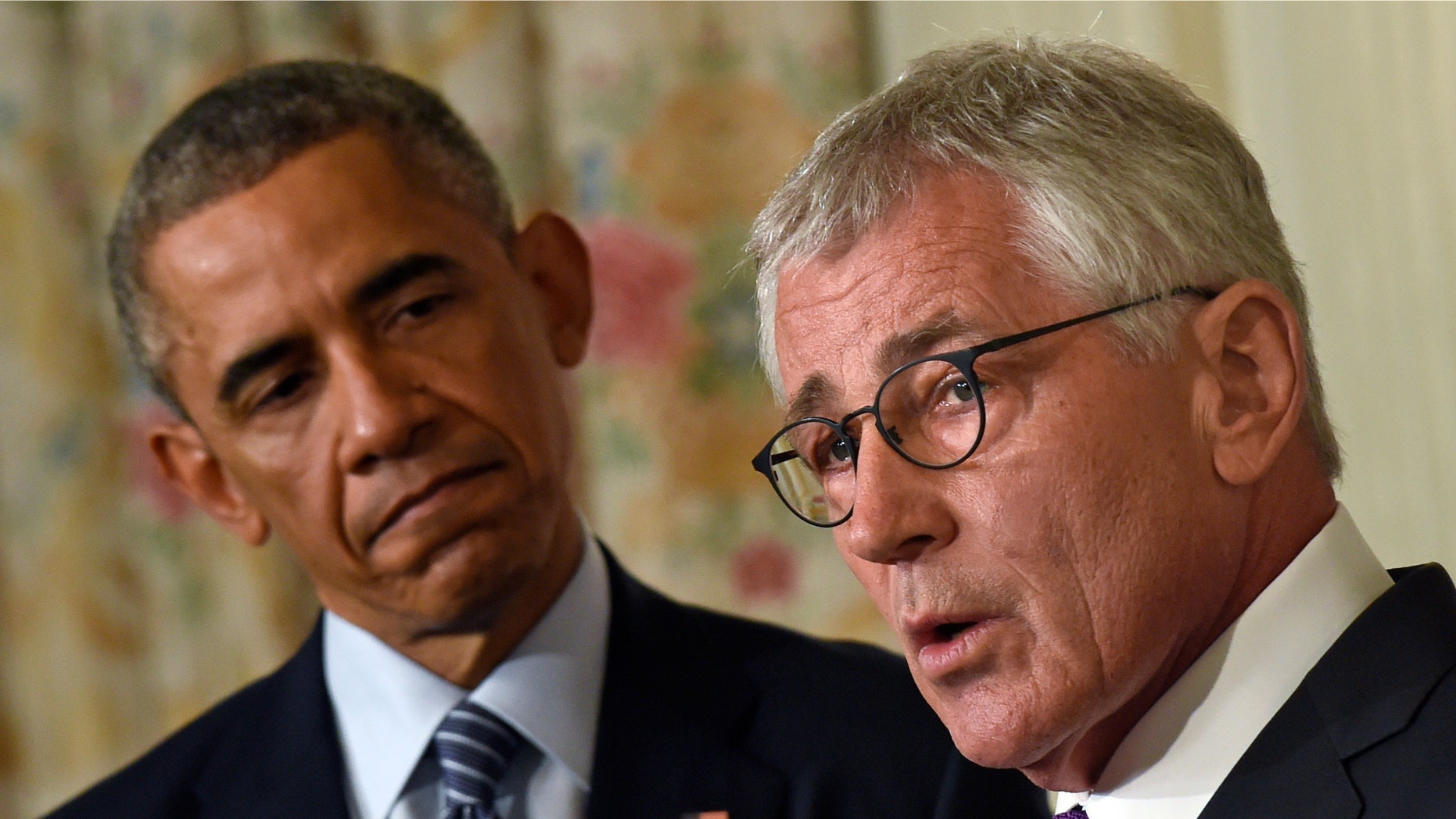 Nov. 24, 2014: President Barack Obama, left, looking to Defense Secretary Chuck Hagel, right, as he talks about his resignation during an event in the State Dining Room of the White House in Washington.