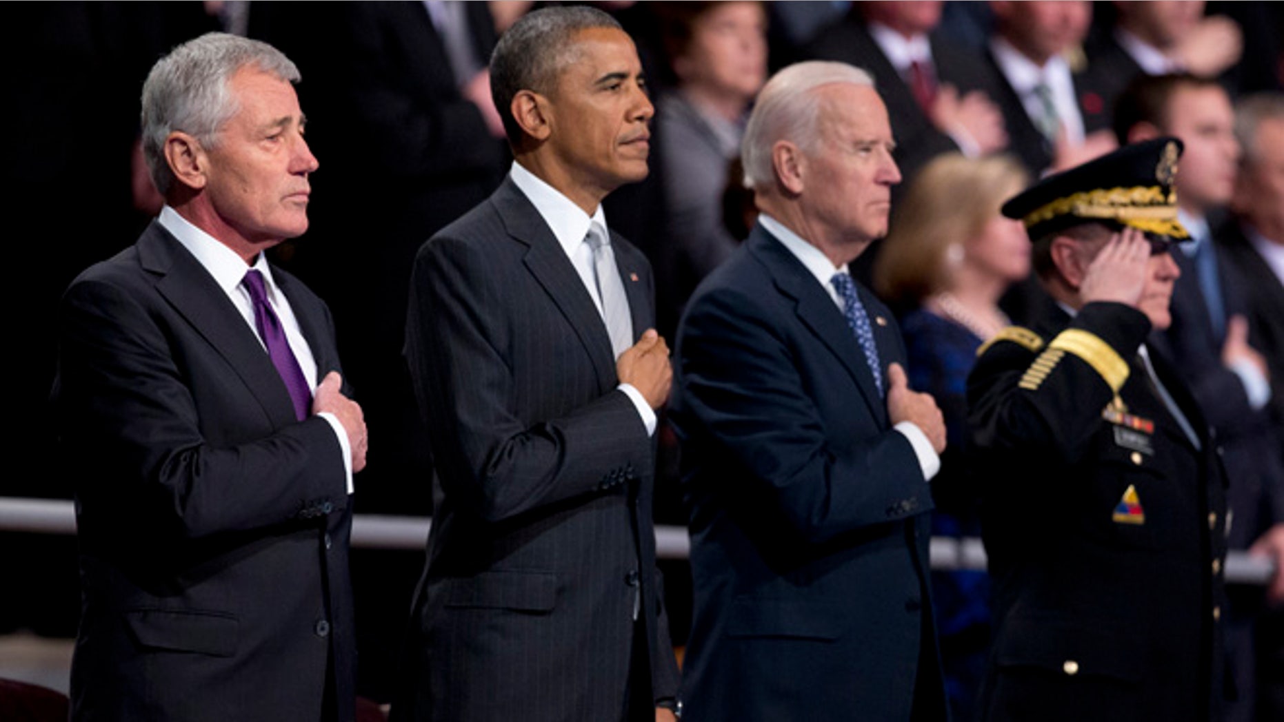 Jan. 28, 2015: From left, outgoing Defense Secretary Chuck Hagel, President Barack Obama,Vice President Joe Biden and Joint Chiefs Chairman Gen. Martin Dempsey, put their hands over their heart as the National Anthem is played during the farewell tribute in honor of Hagel.