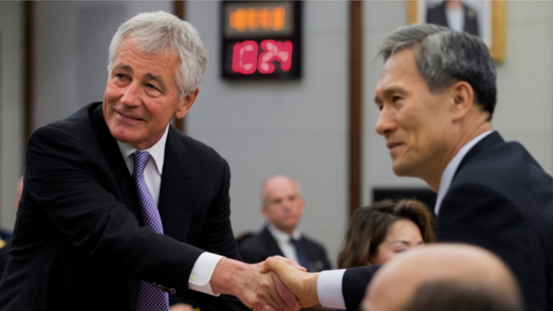 Oct. 2, 2013: U.S. Secretary of Defense Chuck Hagel, left, and South Korean Defense Minister Kim Kwan-jin, shake hands for a photograph at the 45th Security Consultative Meeting at Dfense Ministry in Seoul, South Korea.