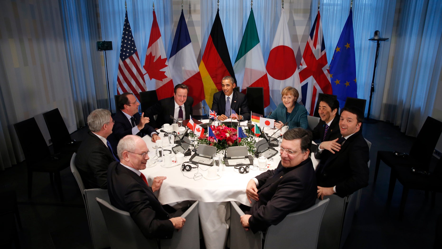 President of European Union Council Herman Van Rompuy, Canada's Prime Minister Stephen Harper, France's President Francois Hollande, Britain's Prime Minister David Cameron, U.S. President Barack Obama, Germany's Chancellor Angela Merkel, Japan's Prime Minister Shinzo Abe, China's President Xi Jinping and EU Commission President Jose Manuel Barosso (L-R, clockwise) meet during the Nuclear Security Summit in The Hague on March 24, 2014.