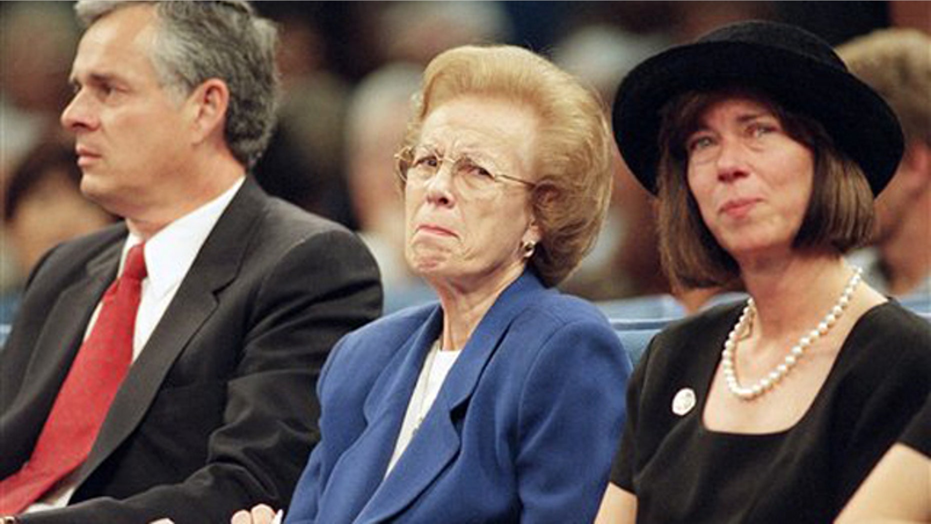 In this Oct. 17,1997 file photo Ramona Hahn, wife of the late supervisor Kenneth Hahn flanked by her son Jim, left and daughter, Janice, during a memorial service for her husband at the Crenshaw Christian Center in Los Angeles. Ramona Hahn, the matriarch of a Los Angeles political family, has died at 86. Hahn was the wife of the late Los Angeles County Supervisor Kenneth Hahn, and the mother of former Mayor James Hahn and City Councilwoman Janice Hahn.