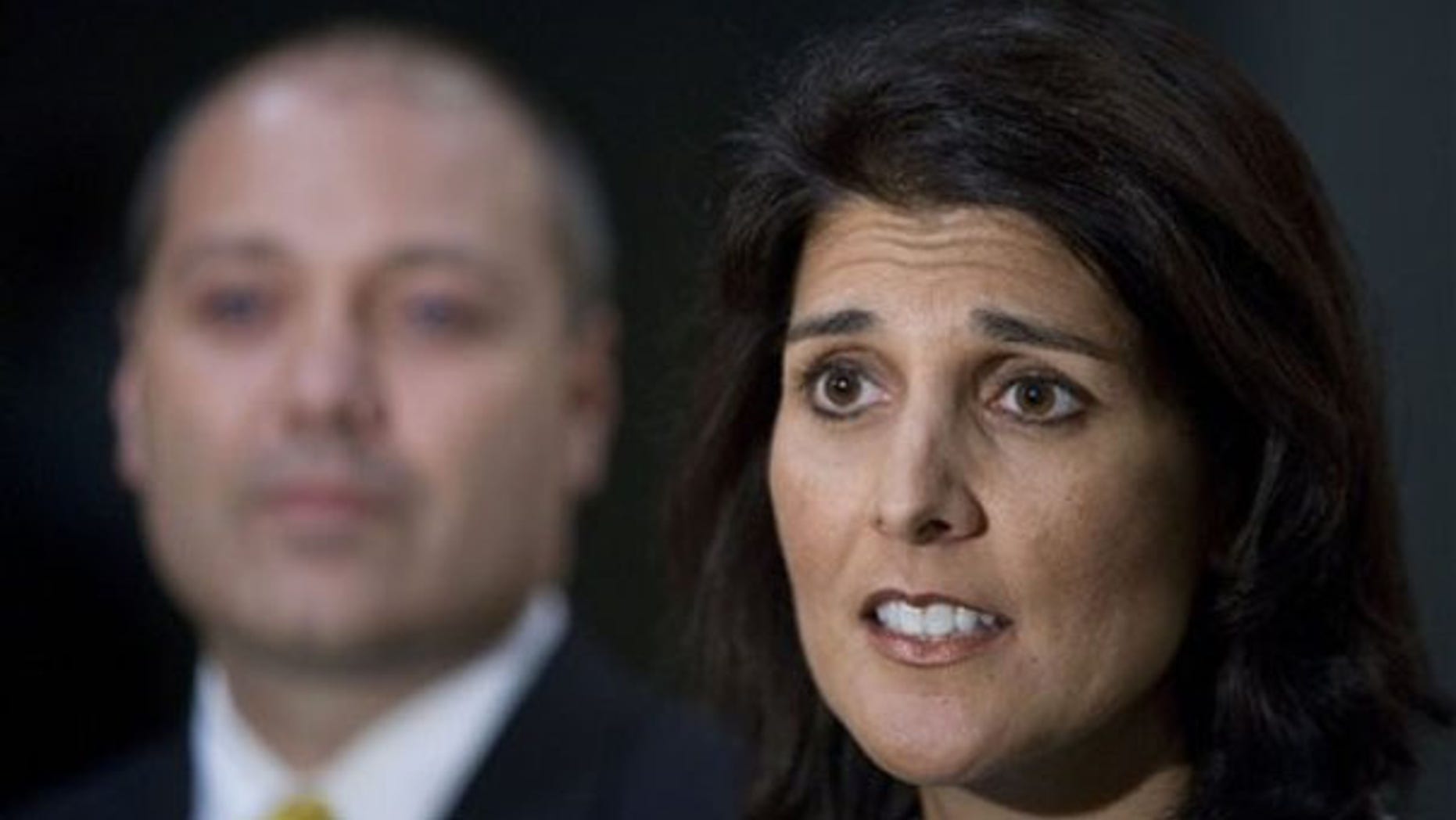 South Carolina state Rep. Nikki Haley talks about allegations of an affair in Greenville, S.C., May 24. She is joined by her husband Michael. (AP Photo)