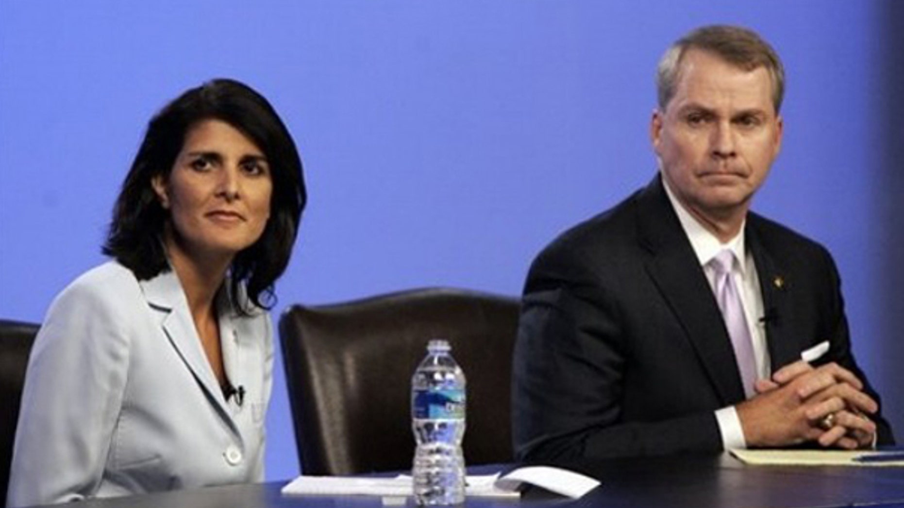 South Carolina state Rep. Nikki Haley, left, and U.S. Rep. Gresham Barrett are asked questions during a GOP gubernatorial debate in Columbia, S.C., June 17. (AP Photo)