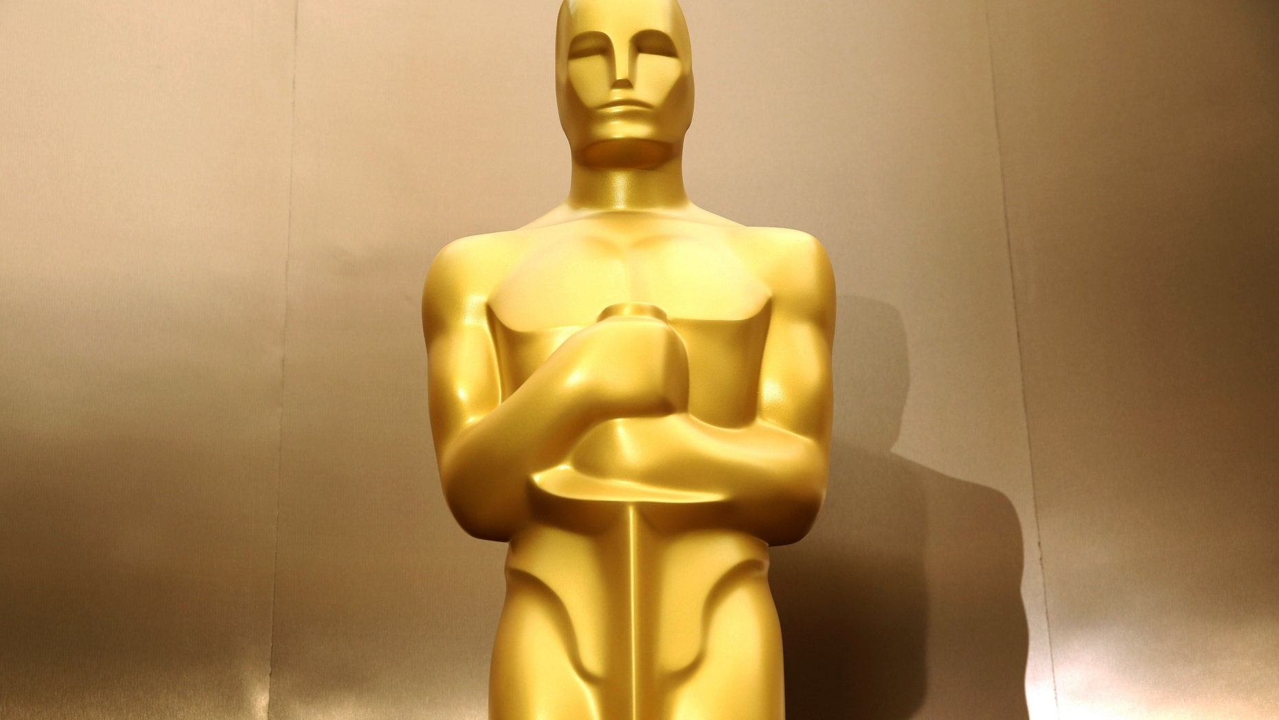 February 28, 2014. An Oscar statue stands on the red carpet as preparations are made for the 86th Academy Awards in Los Angeles. The Academy Awards will be held at the Dolby Theatre on Sunday, March 2.