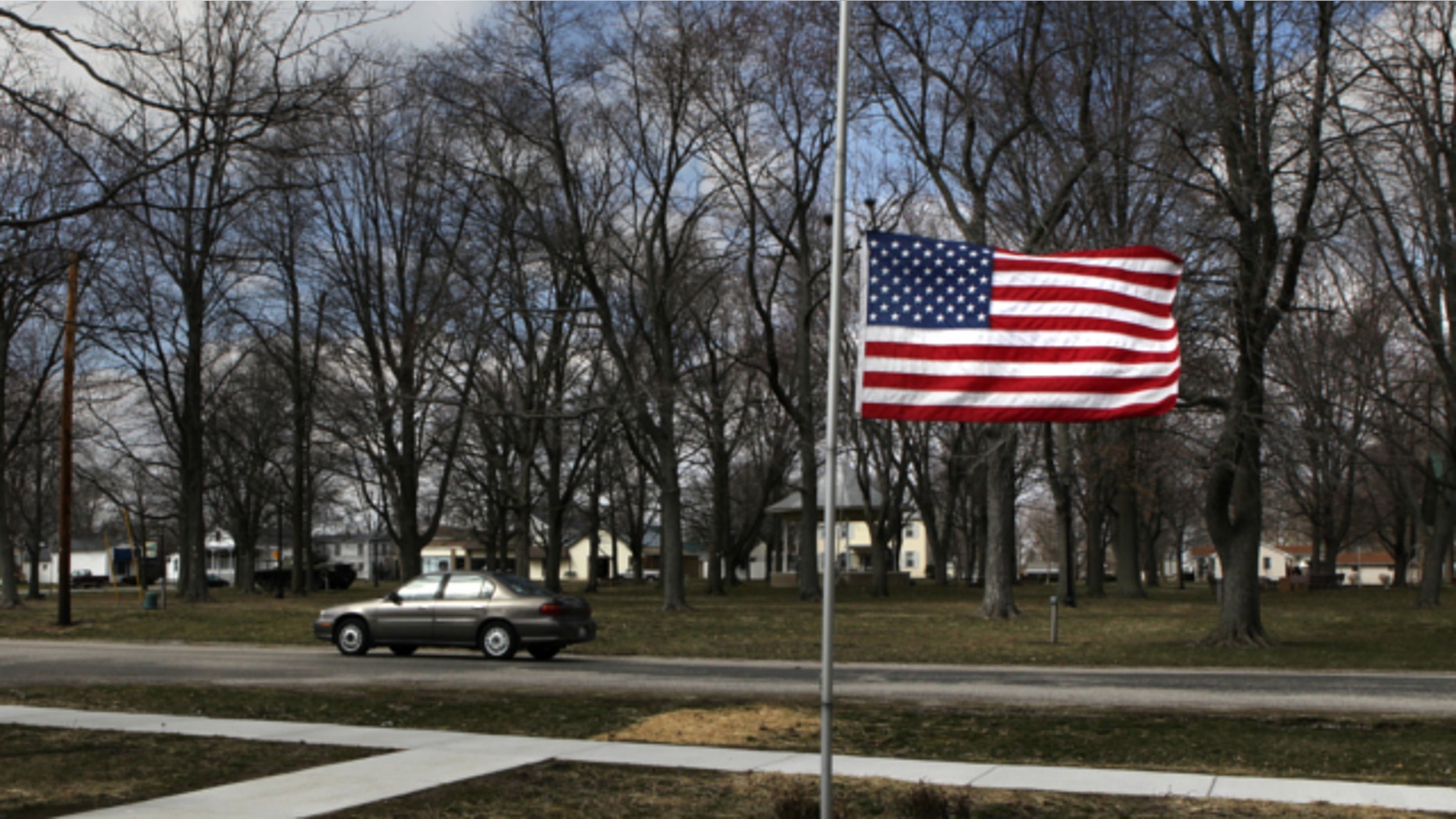 March 20, 2013: Marine Aaron Ripperda of Highland, Ill. is remembered with flags at half mast in nearby downtown Marine, Ill., where his father lives.