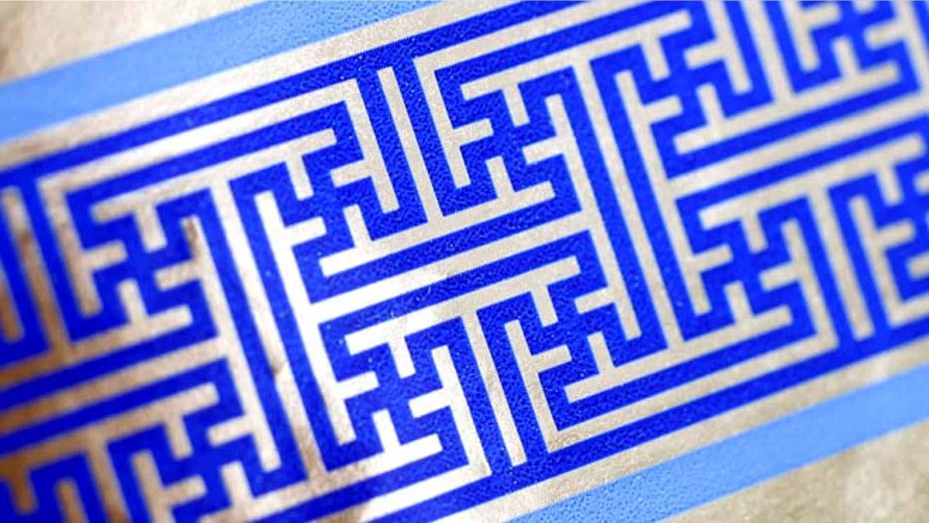 Dec. 8, 2014: Cheryl Shapiro displays the Hanukkah gift wrap with a swastika-like pattern she found at Walgreens in Northridge, Calif. The wrapping paper has been recalled from stores nationwide.