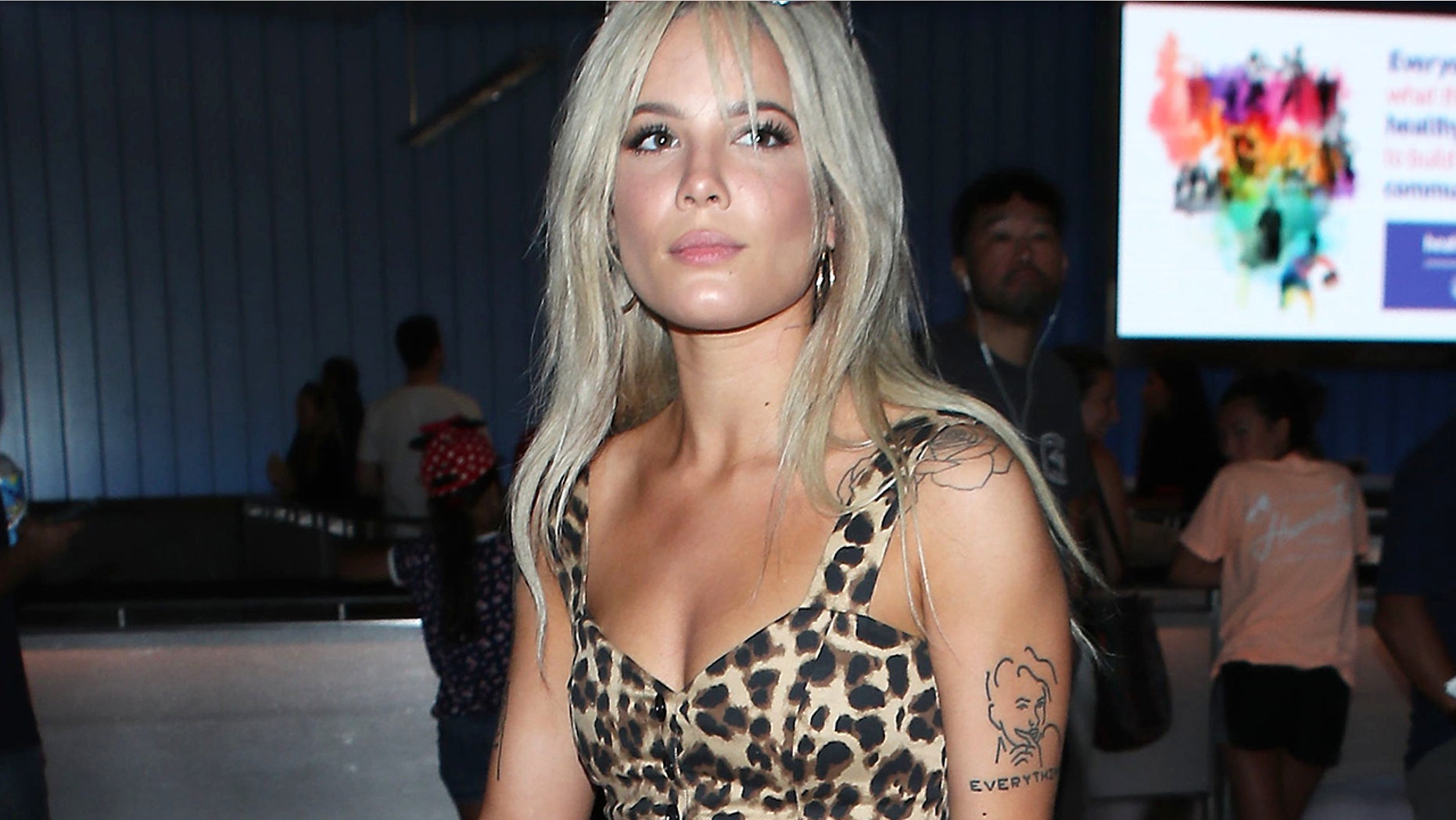 Halsey arrives in Los Angeles after performing in Santiago, Chile in June 2018. The "Eyes Open" singer puts her perfect, tan body on display in a tiny leopard-print top, paired with cheeky denim cutoffs and black cowboy boots.