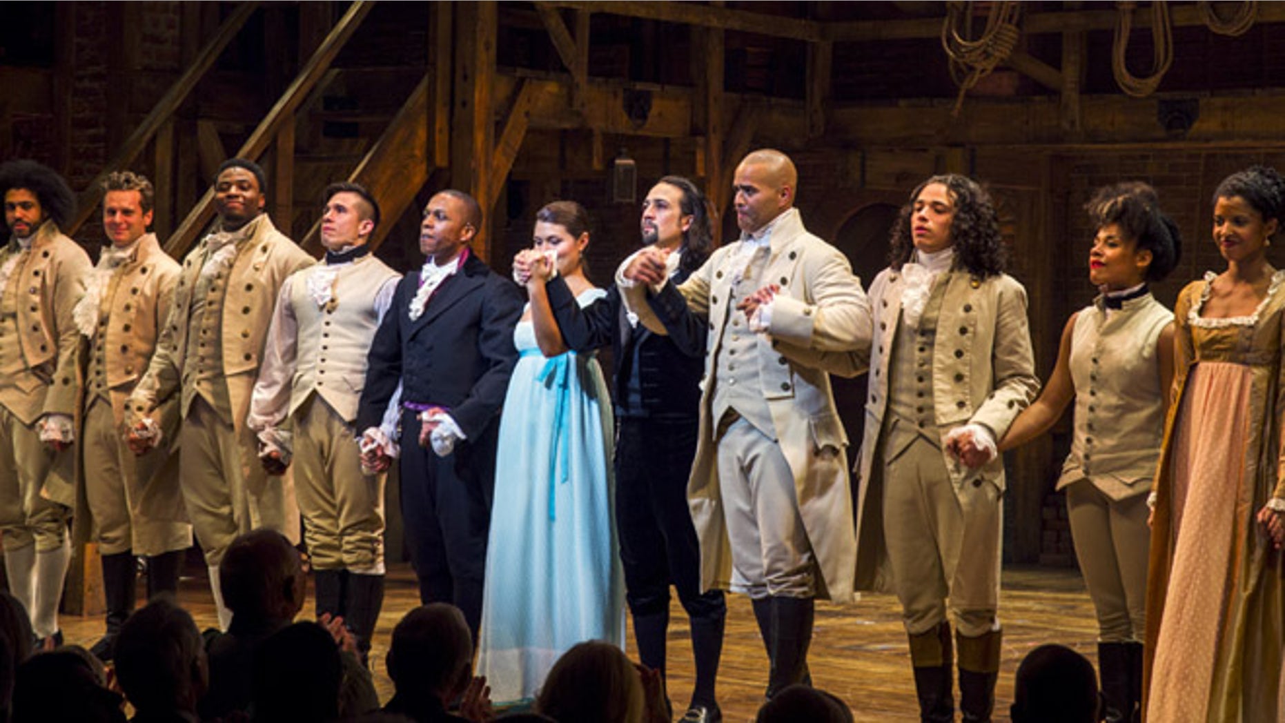 August 6, 2015: Lin-Manuel Miranda (5th right), actor and creator of the of the play 'Hamilton' bows to the audience after opening night of the play on Broadway in New York.