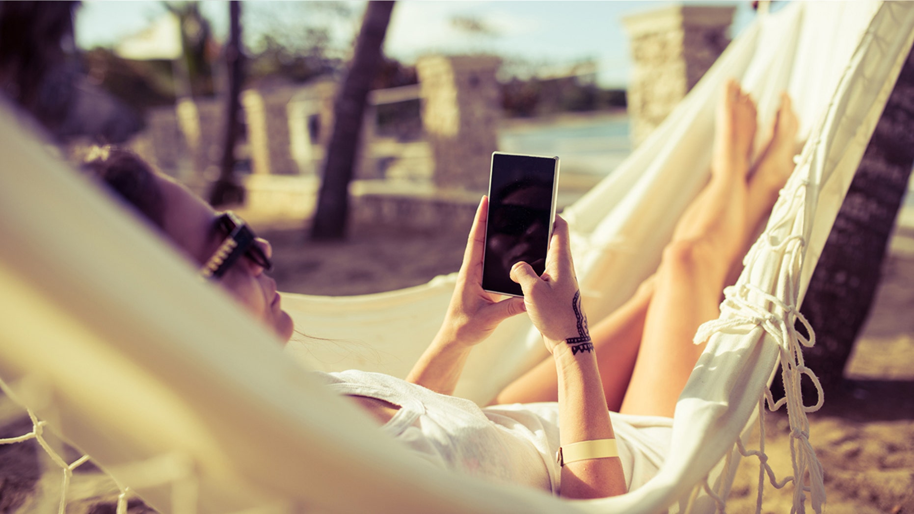 Study participants checked their phone an average of every 12 minutes while on vacation — even when there were hammocks involved!