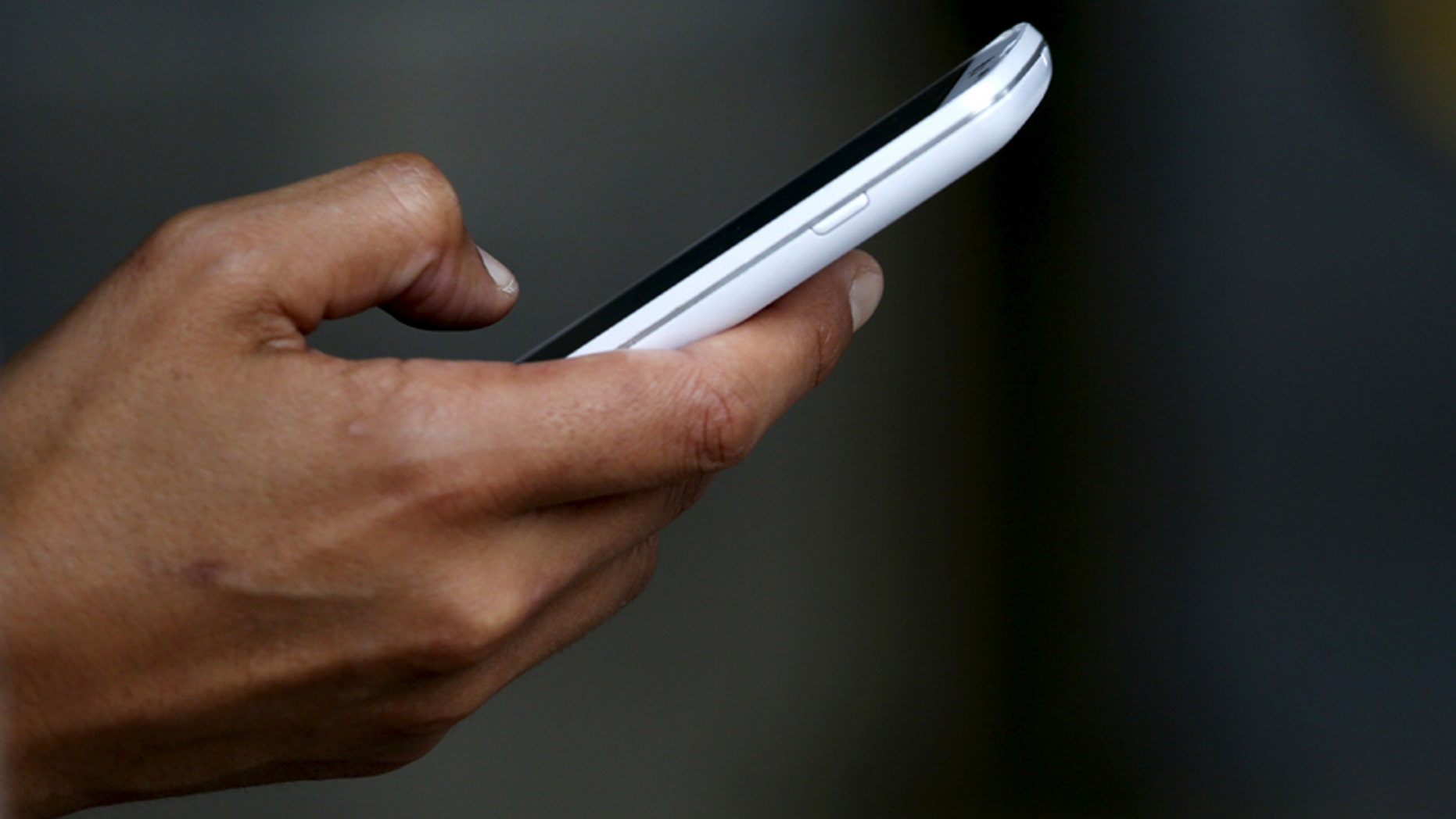 A woman uses her mobile device while working out in San Francisco.
