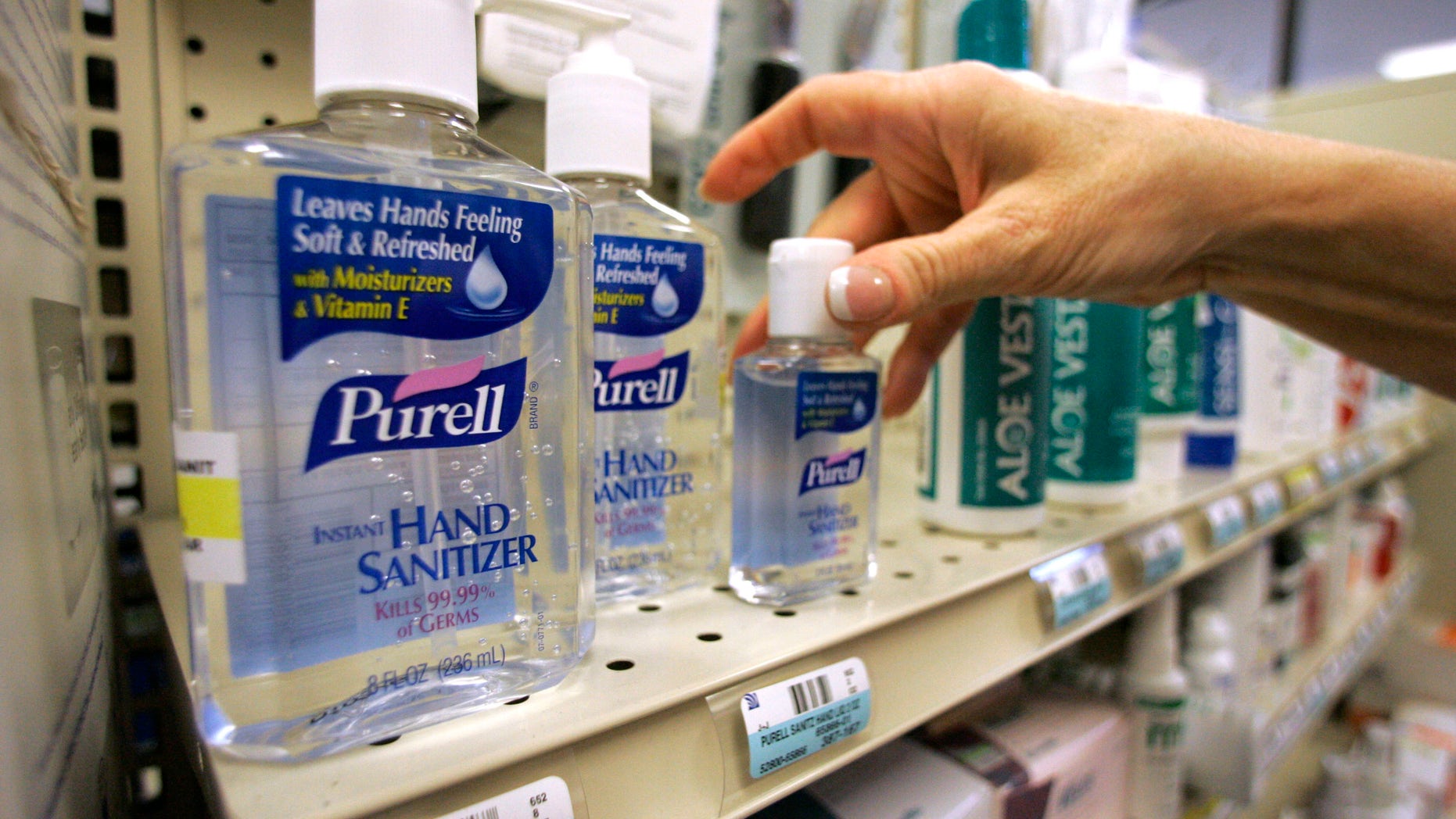 FILE - This Wednesday, April 29, 2009, file photo, shows hand sanitizer on a shelf at a pharmacy in Plano, Texas. Federal health officials want to know whether hand sanitizers used by millions of Americans are as effective at fighting germs as manufacturers claim, and whether there are any health risks to their use. (AP Photo/Donna McWilliam, File)