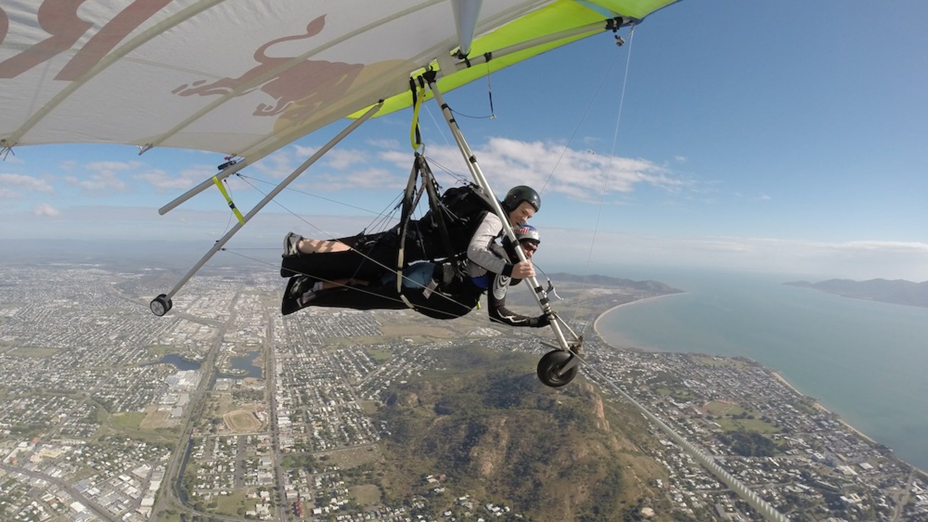 Red Bull Racing Australia driver, Craig Lowndes, and world-record holding hang-glider Jonny Durand during a flight over Townsville, Australia, on July 3, 2014.